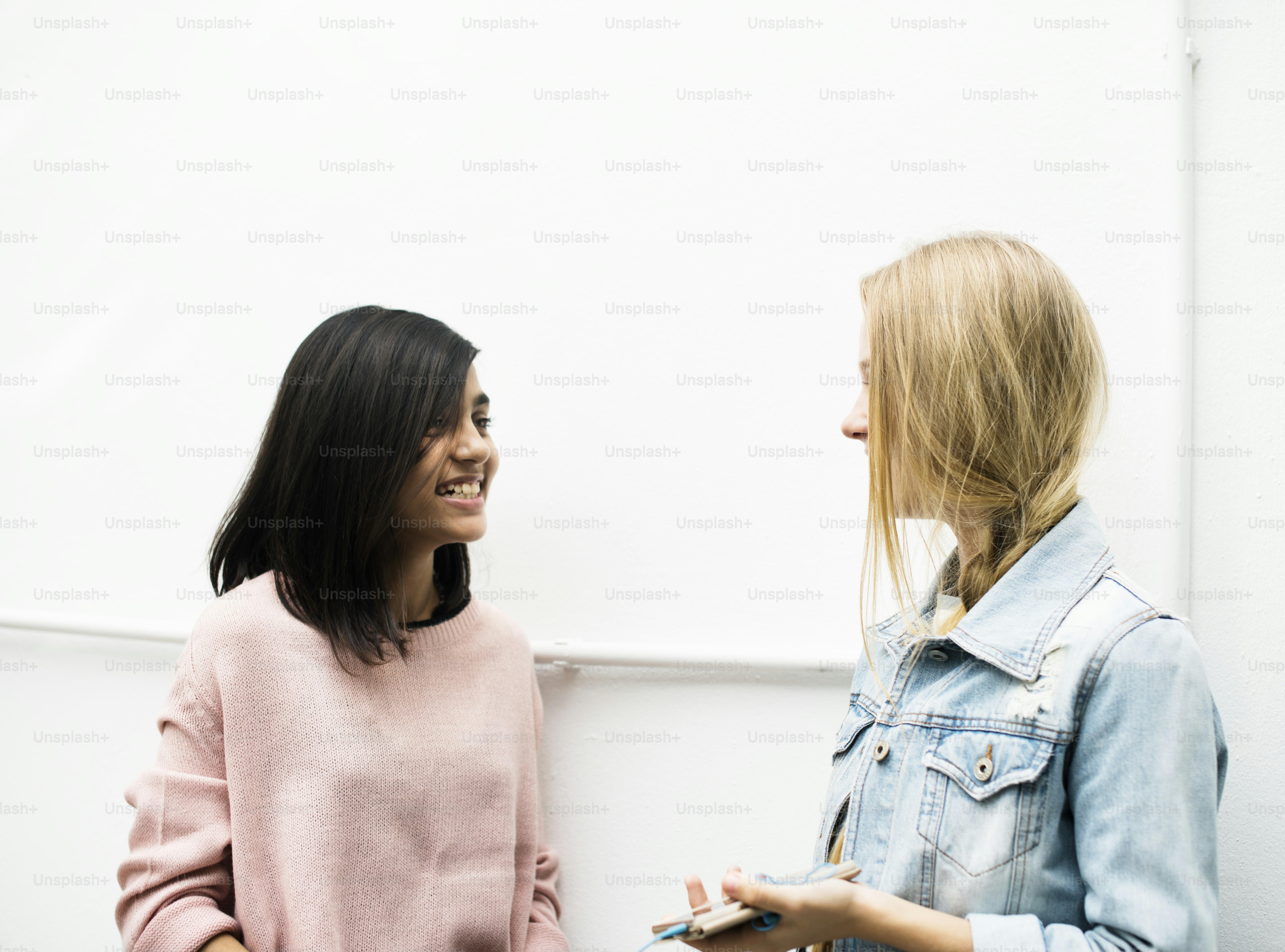 Young girls are talking together