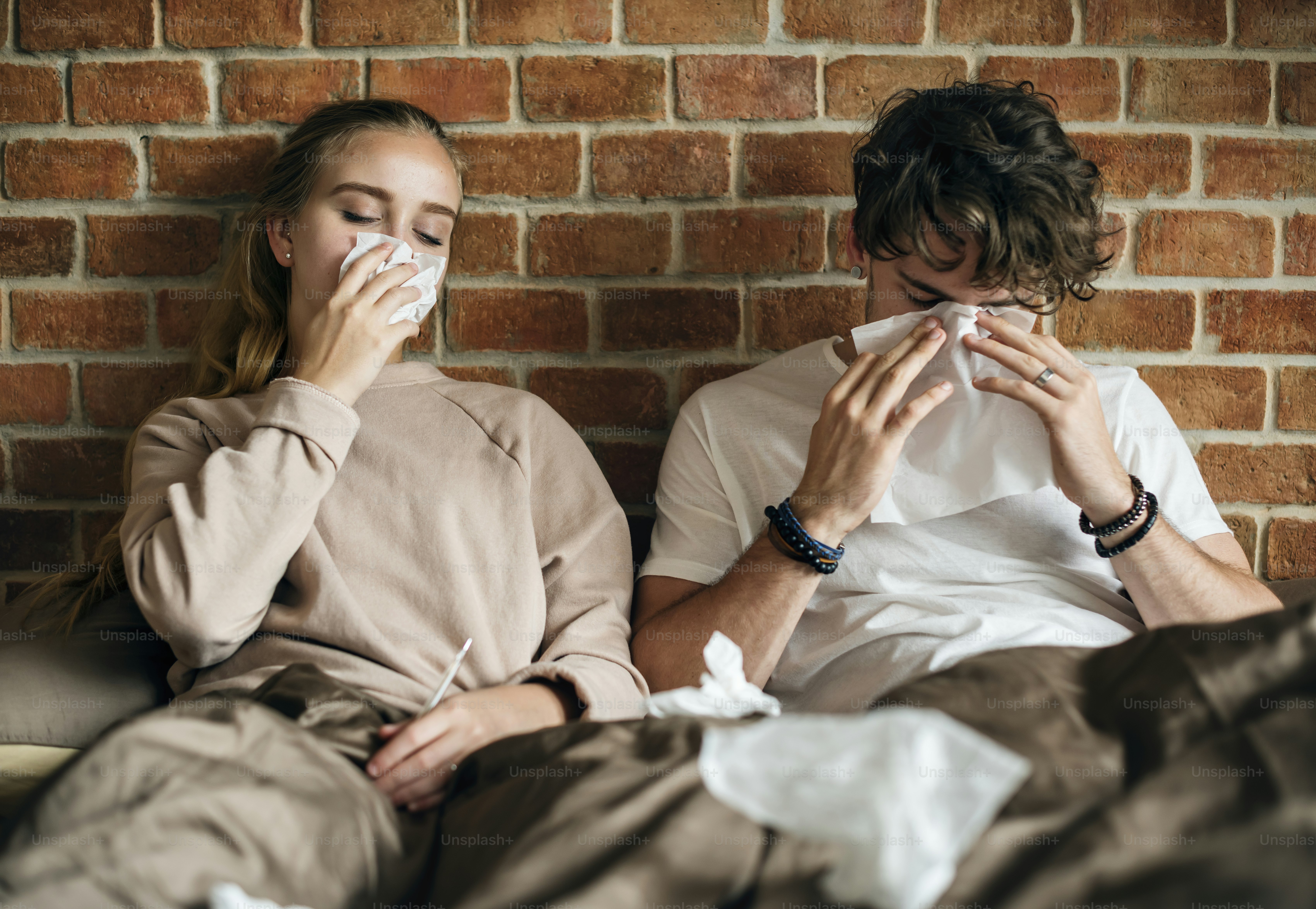 Couple get sick and sitting on the bed