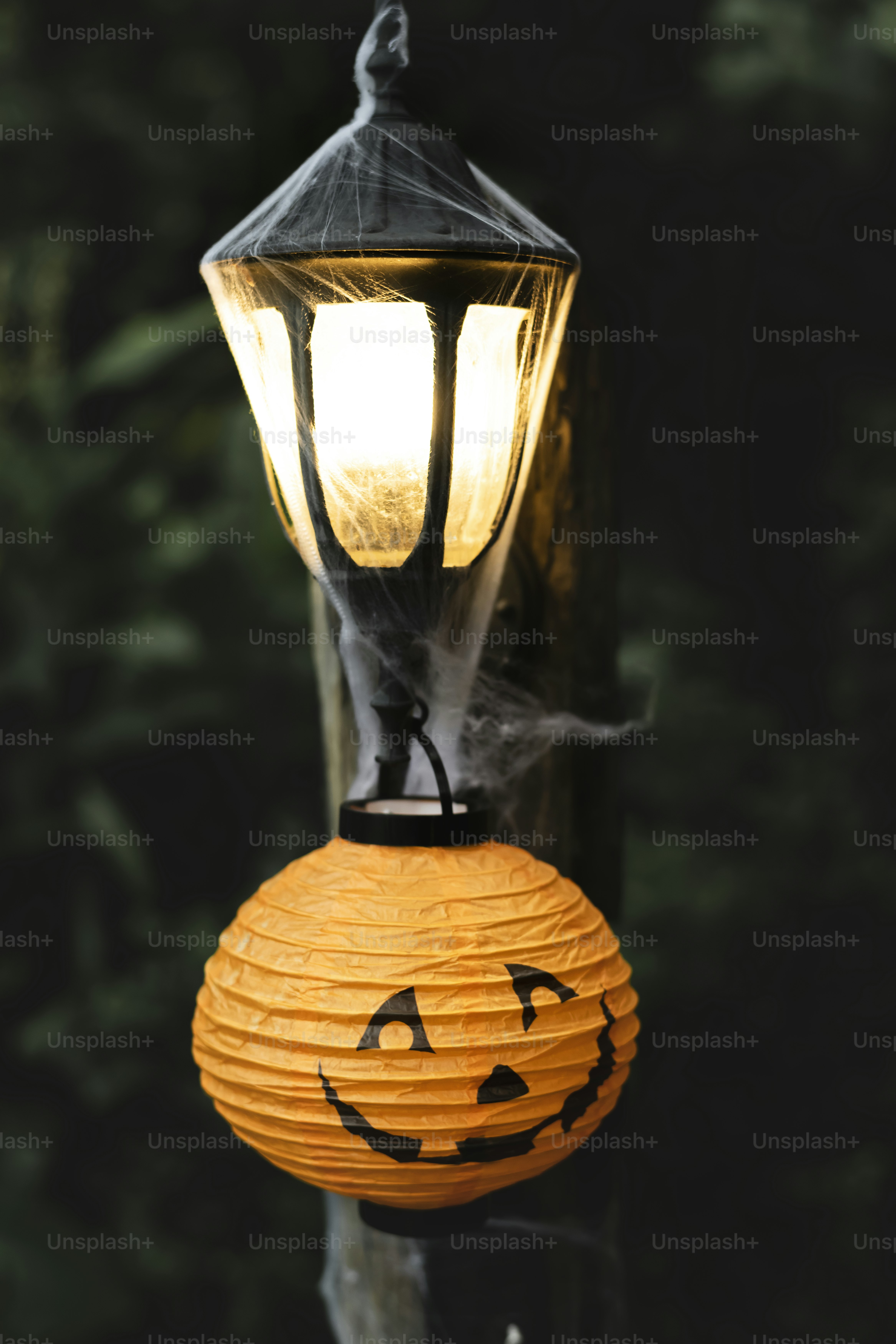 Light post with spiderweb on Halloween