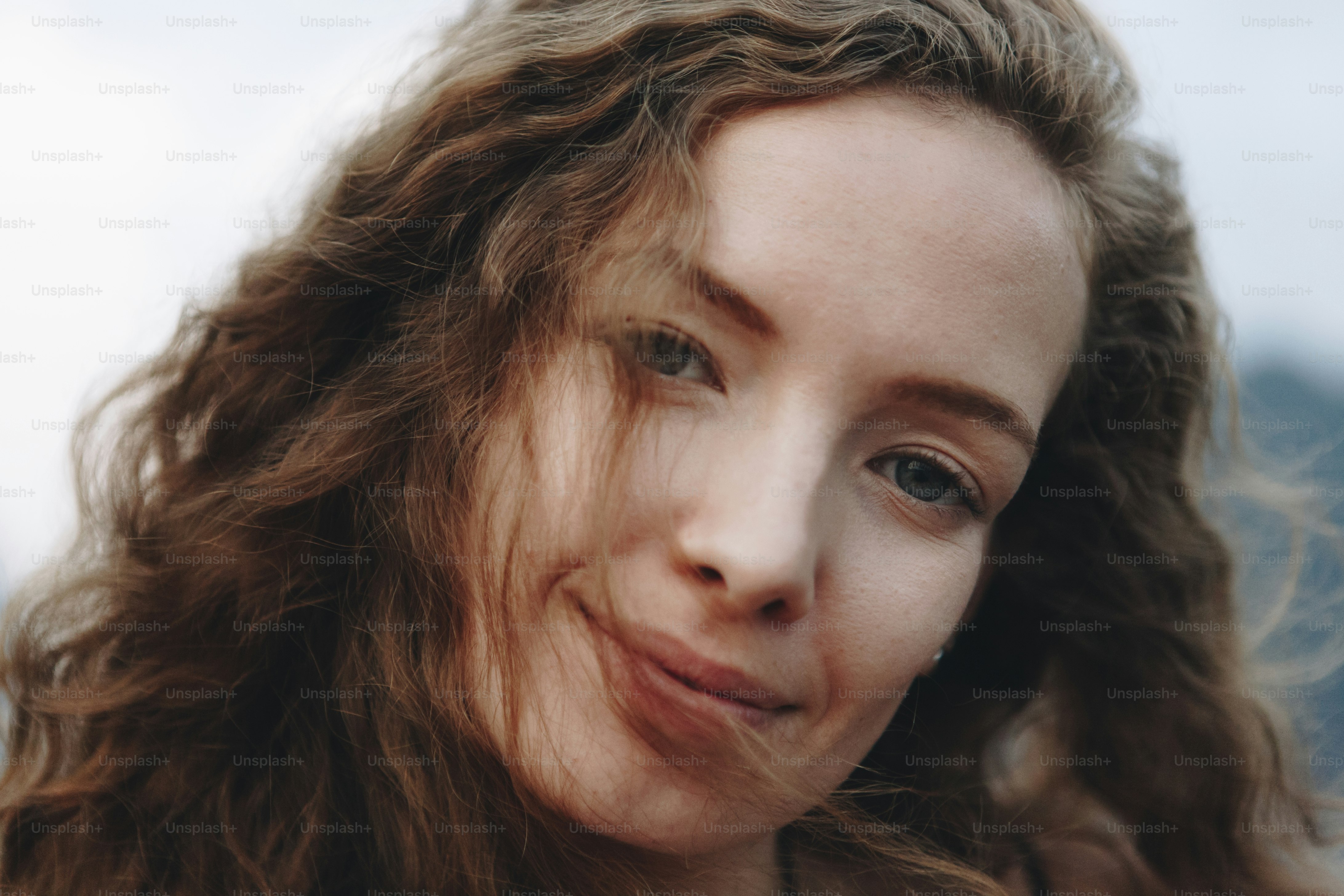 Portrait of a beautiful woman with curly hair
