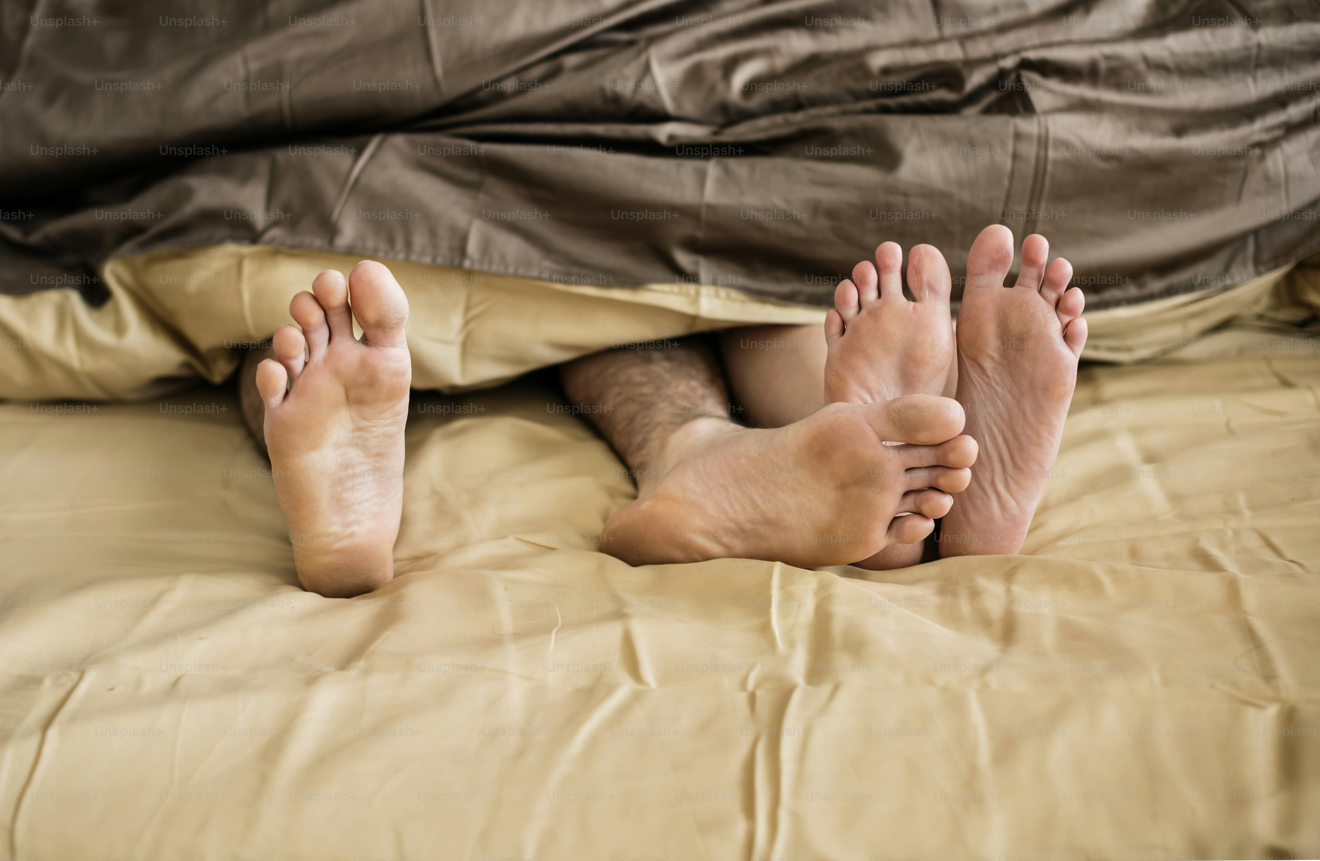 Caucasian couple lying on bed together