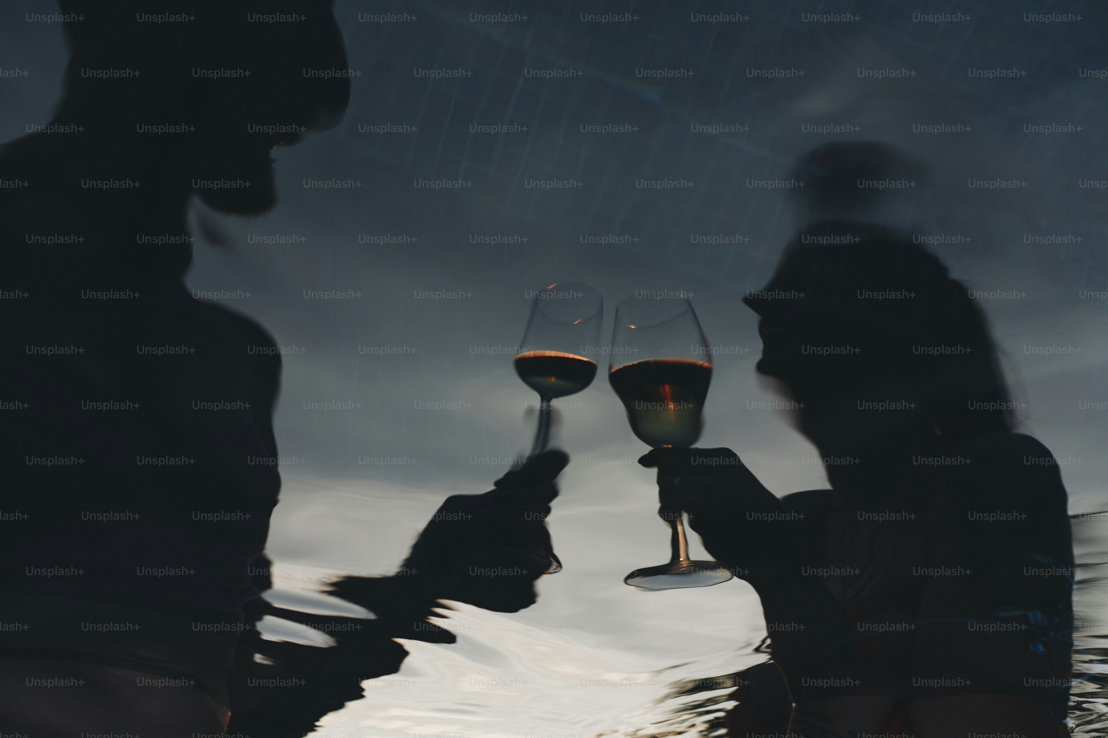 Couple drinking wine in a pool