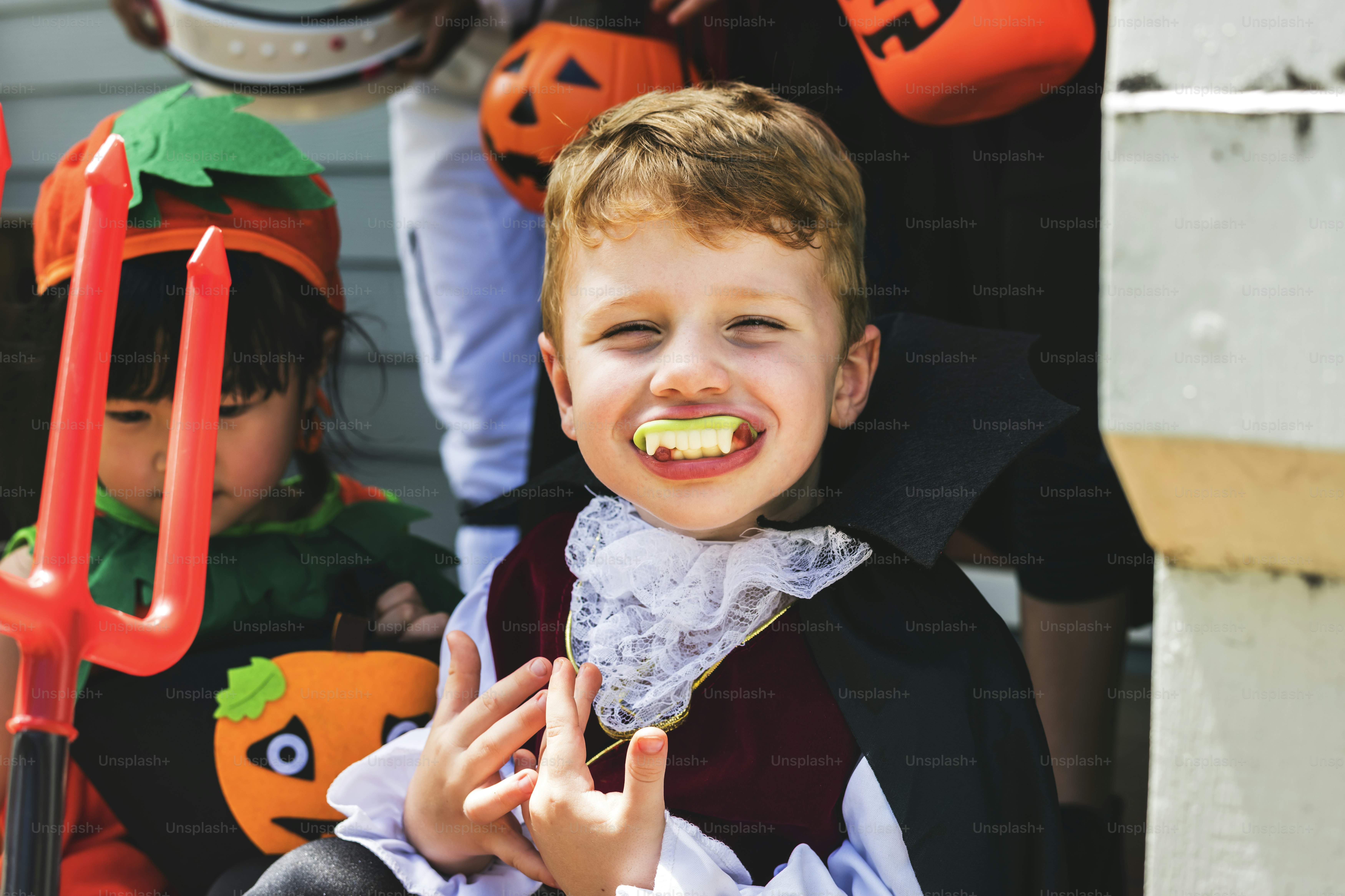 Little children trick or treating on Halloween