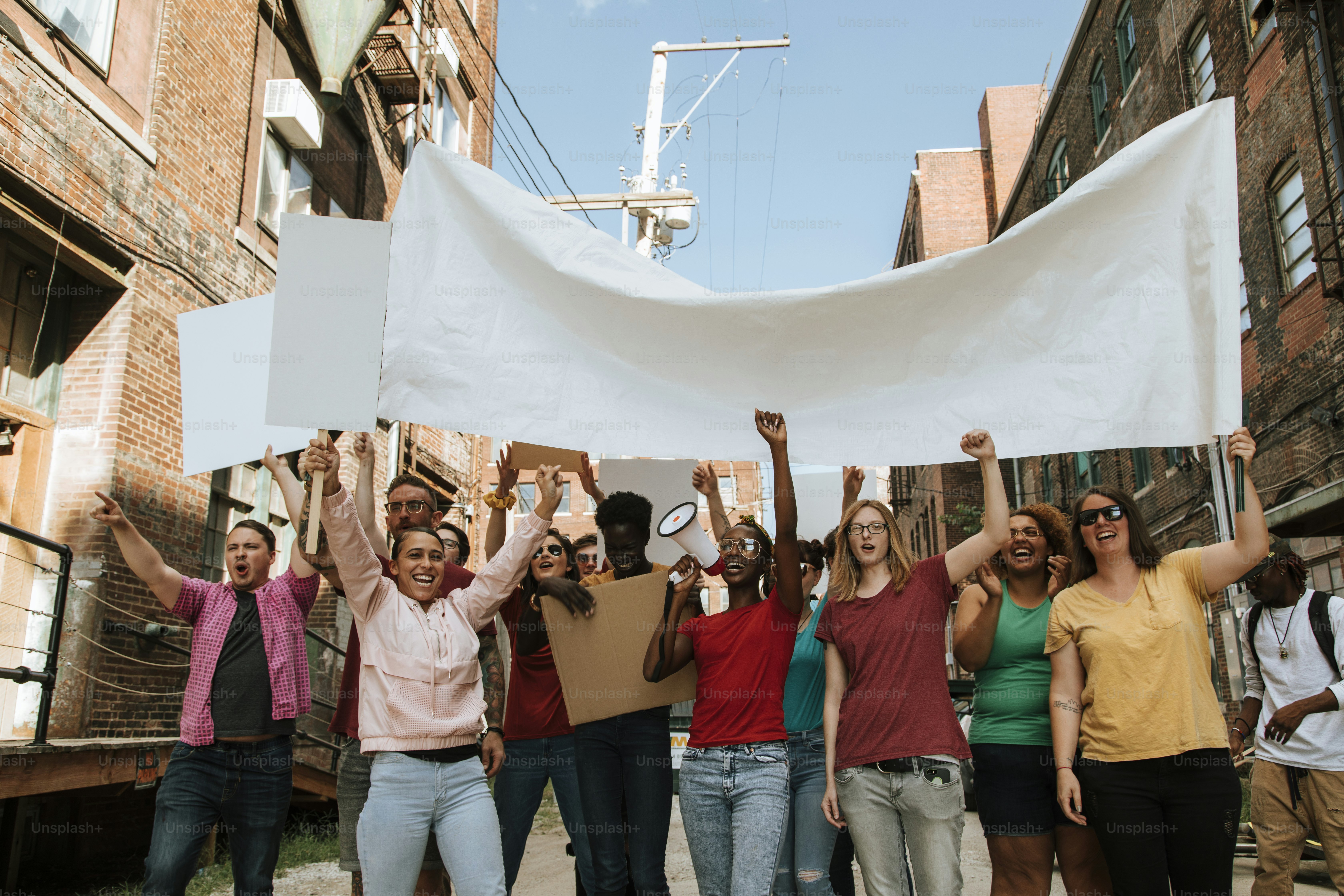 Colorful protesters marching through a city