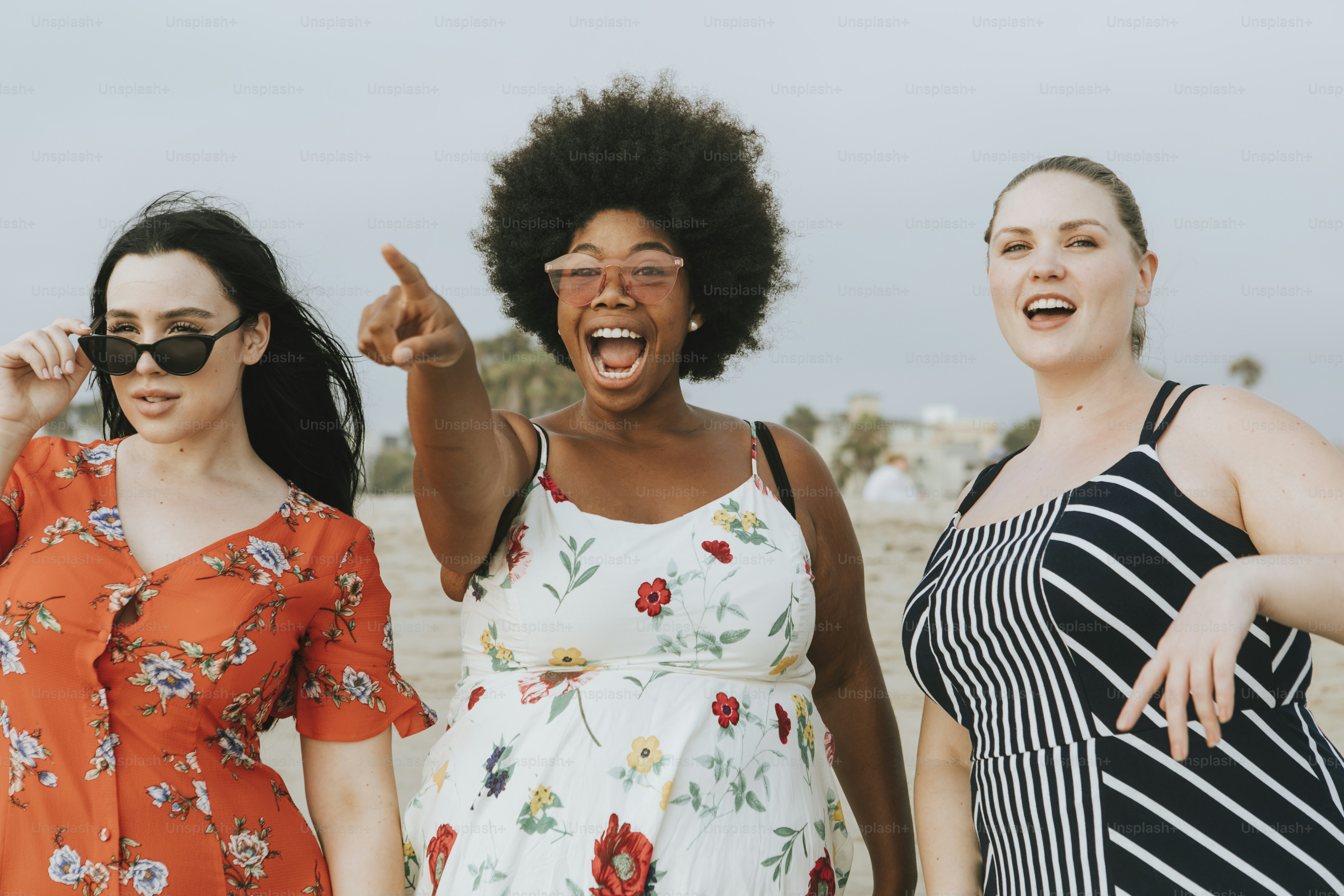 Cheerful diverse plus size women at the beach