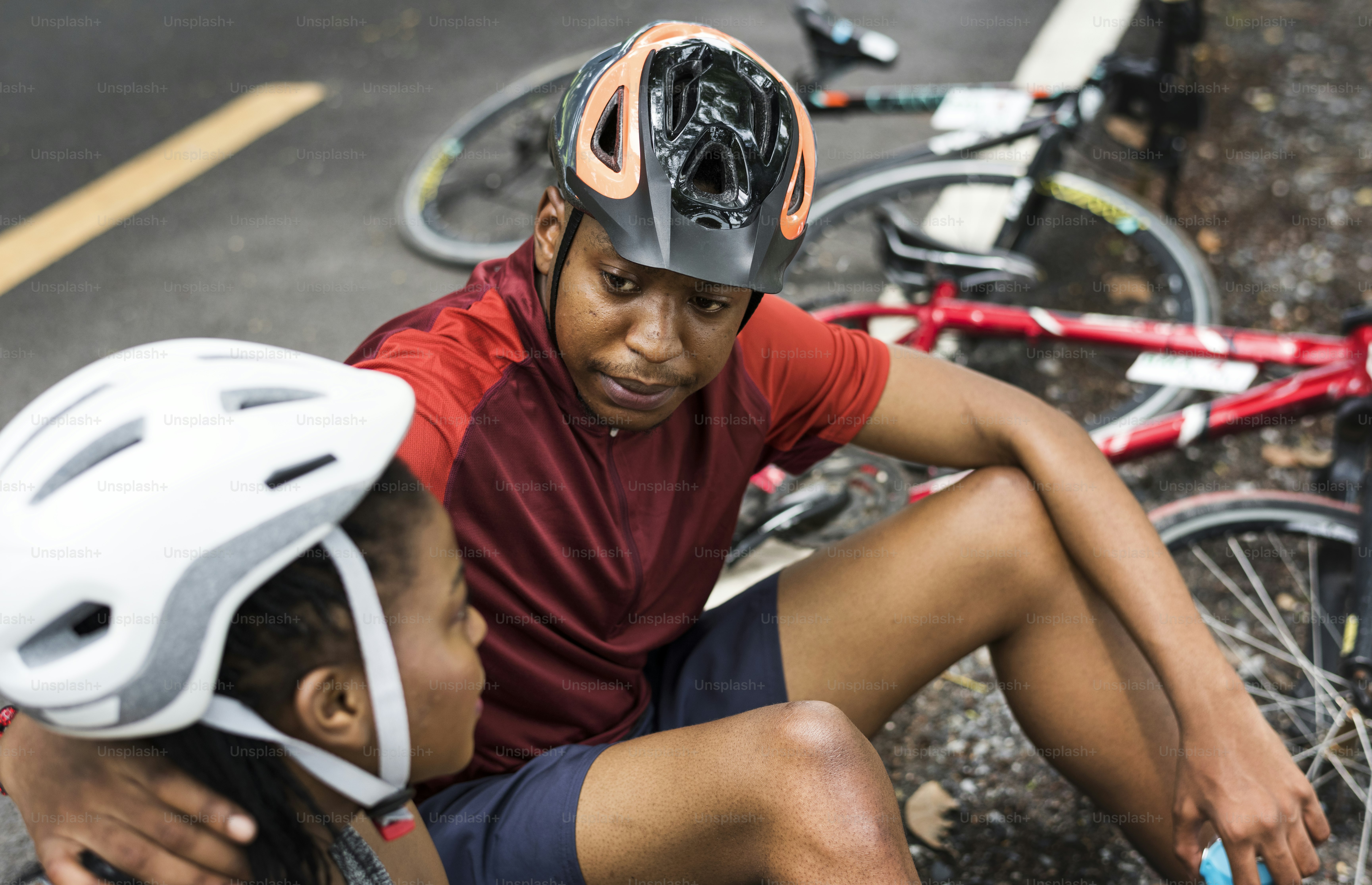 Cyclist couple resting in a park