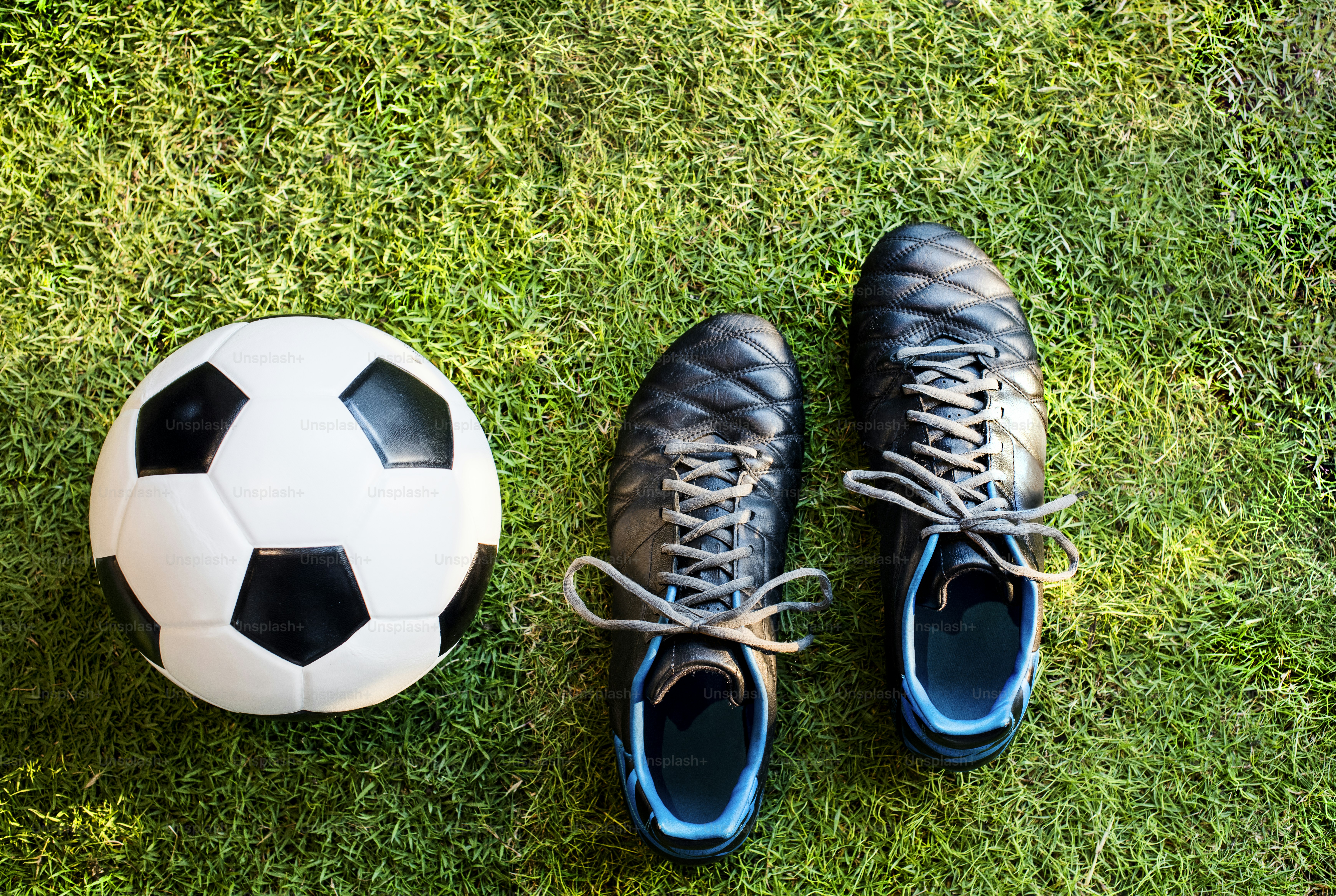 Football and shoes on the yard