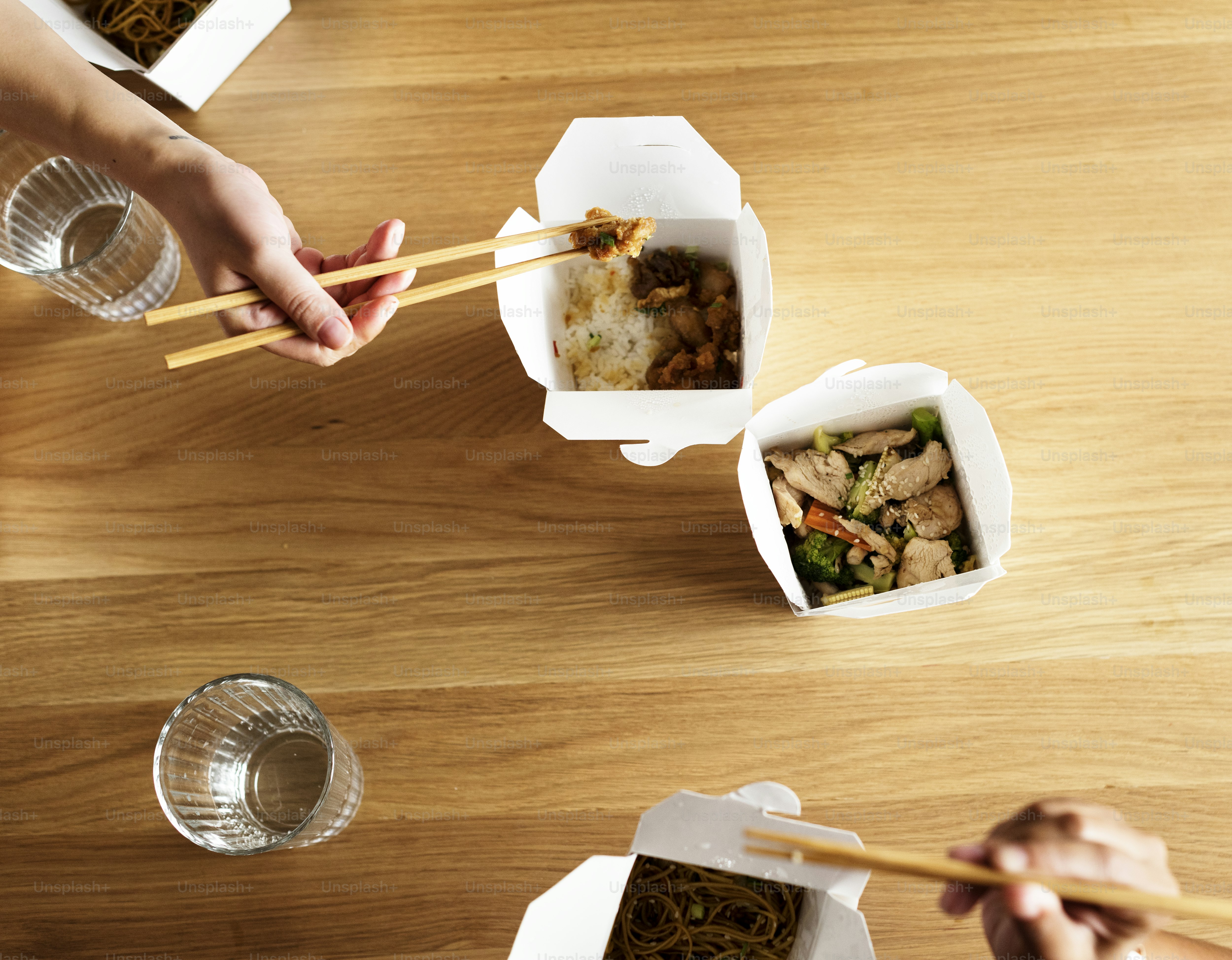 Friends eating Chow mein together