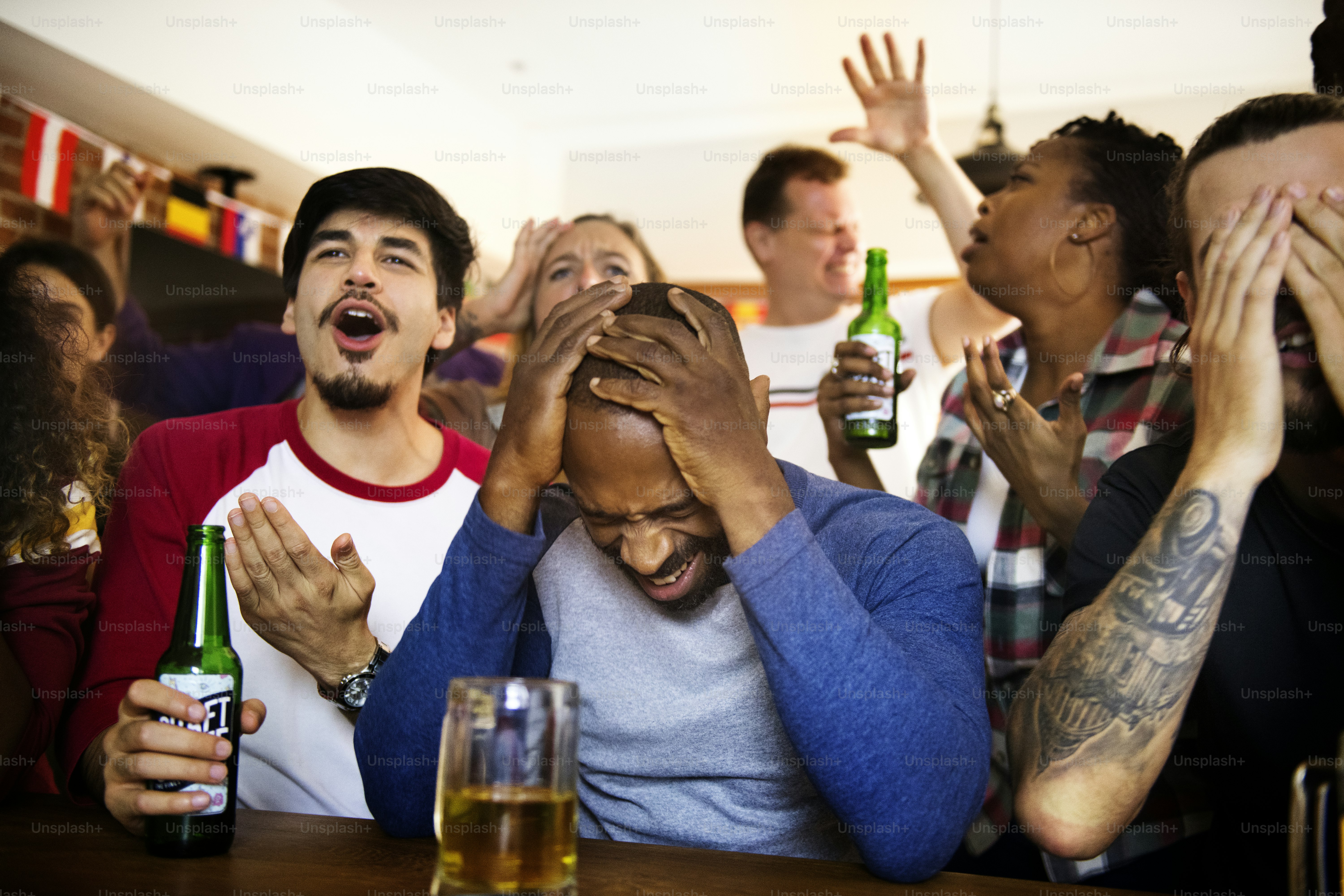 Friends cheering sport at bar together