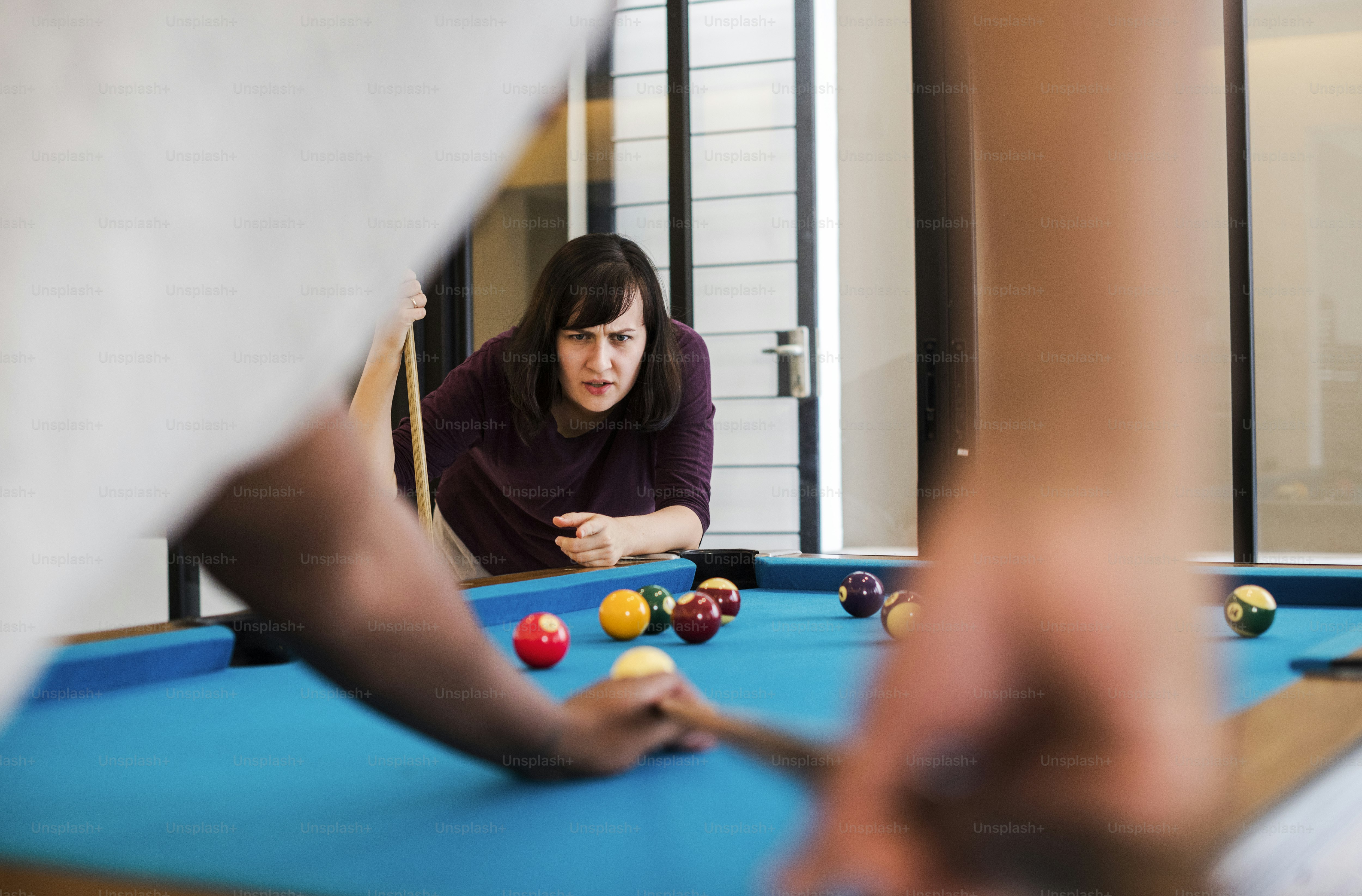Rivalry couple playing a game of pool