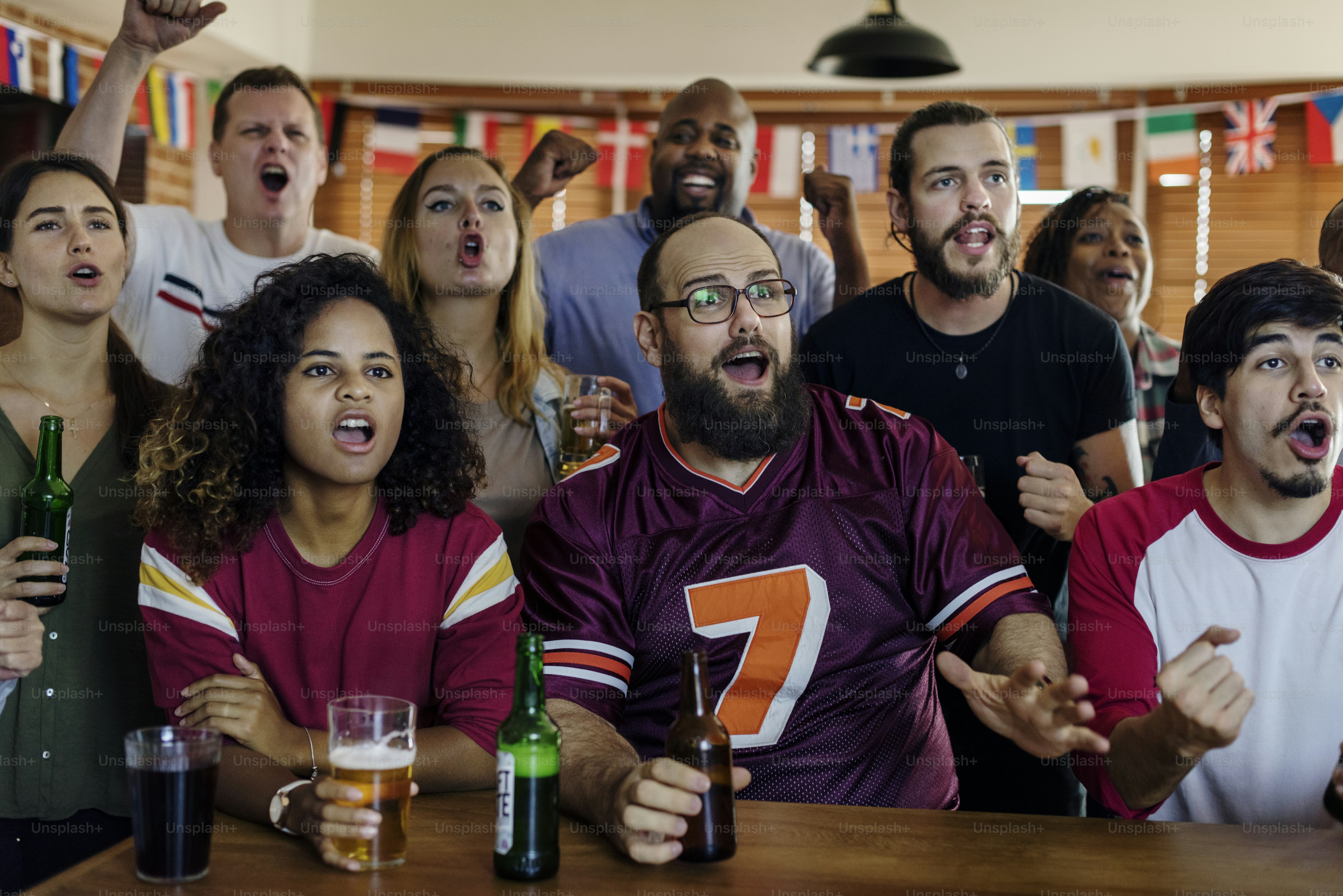 Friends cheering sport at bar together