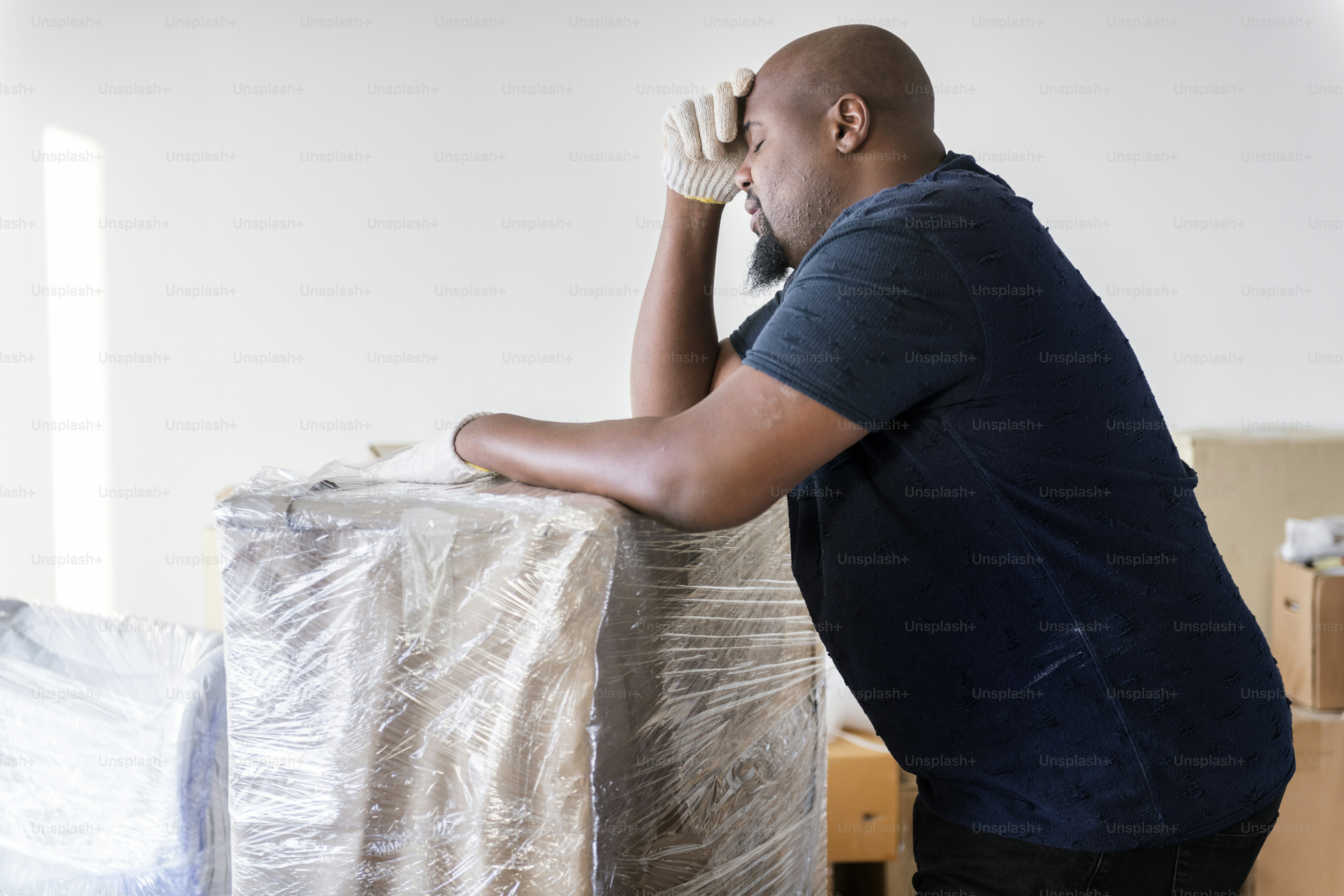 Black man moving furniture