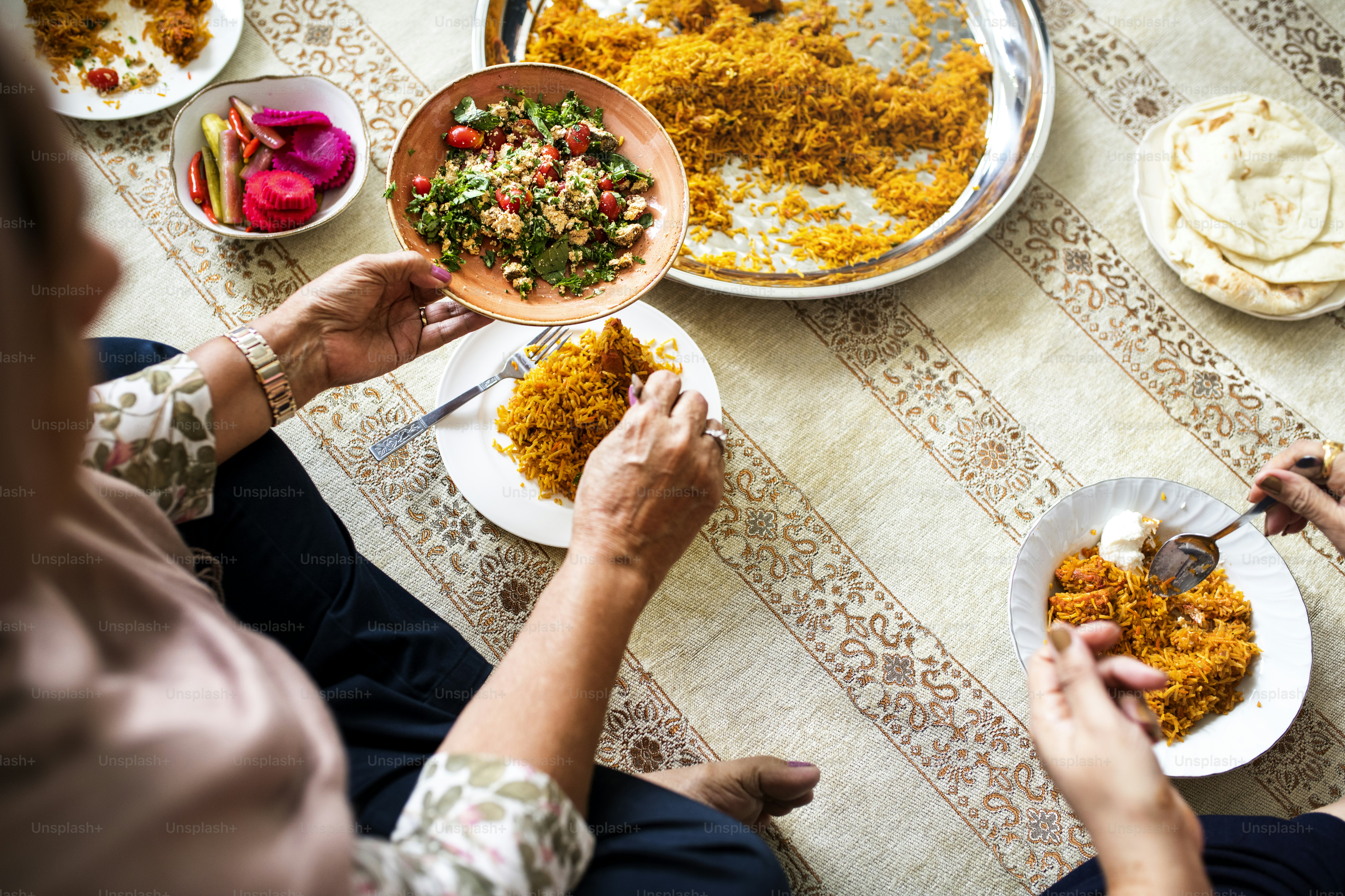 Muslim family having dinner on the floor