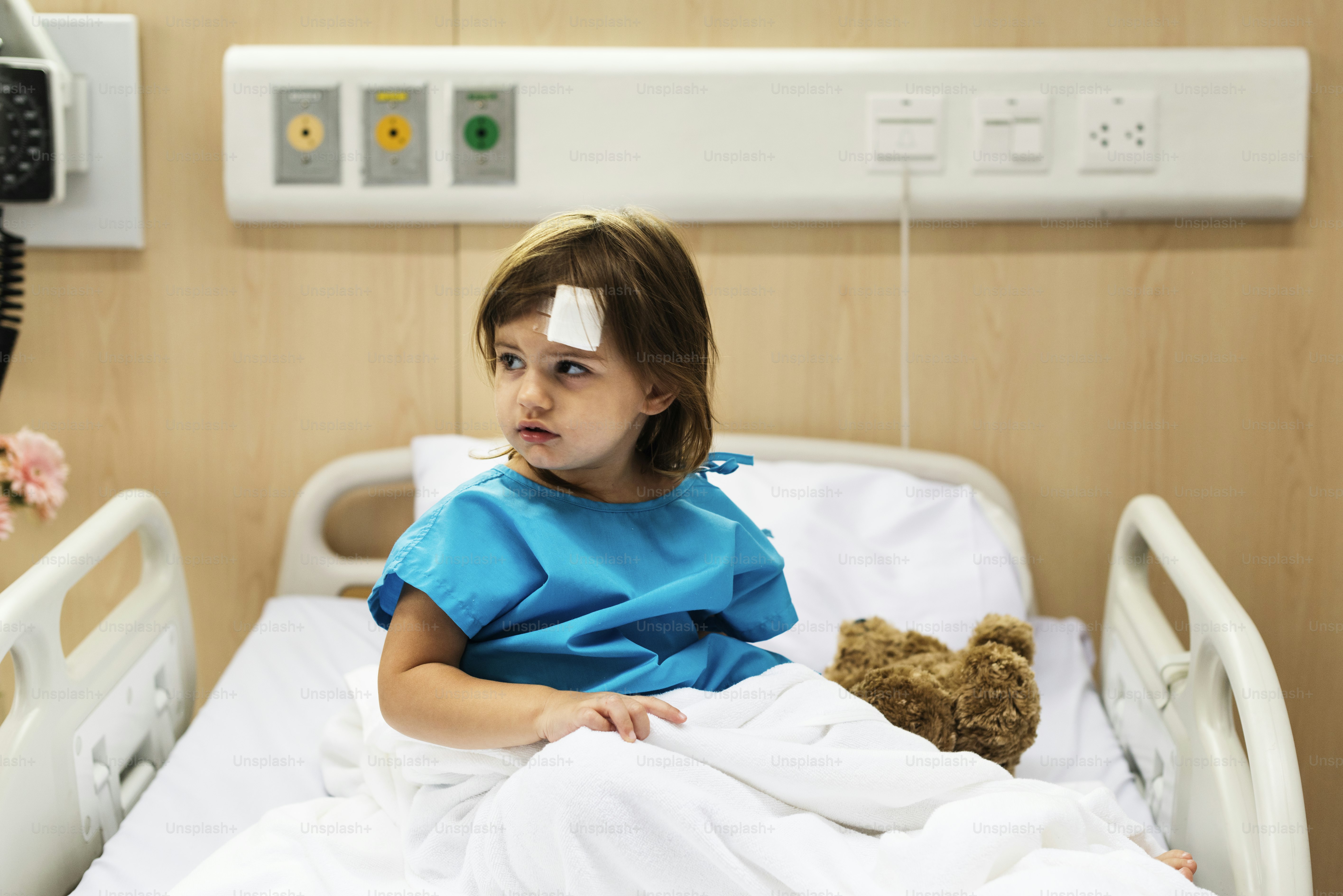 Young sick girl is staying at the hospital