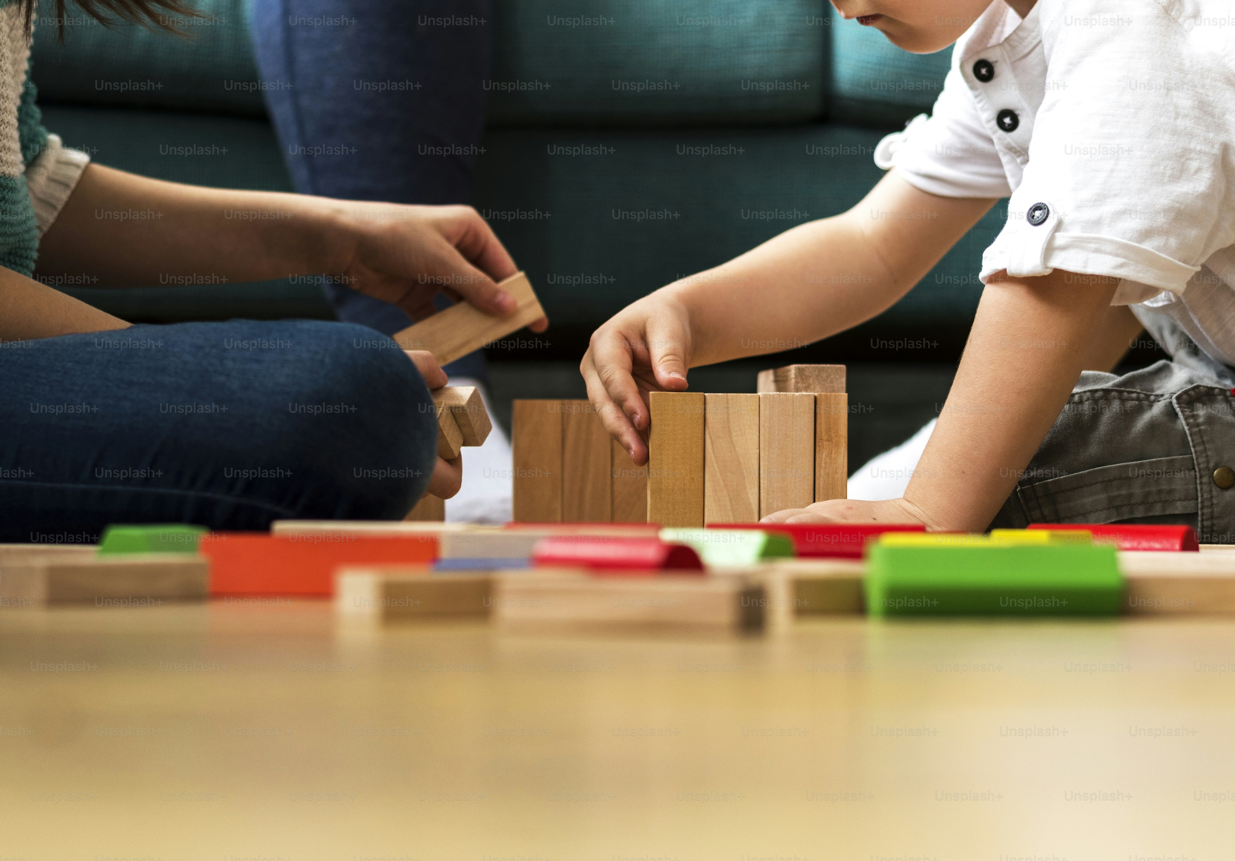Children having fun playing toy blocks