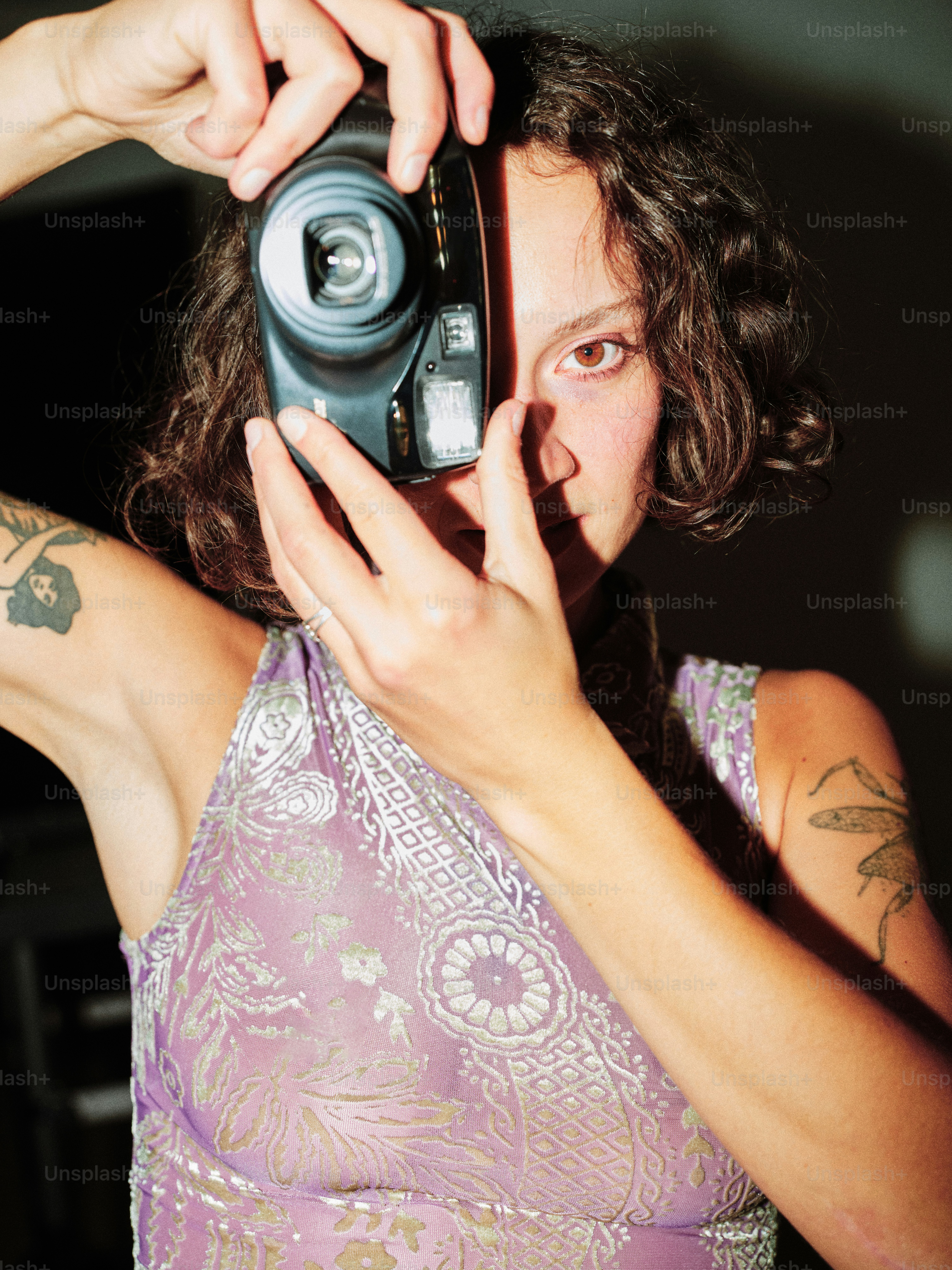 A woman taking a picture of herself with a camera