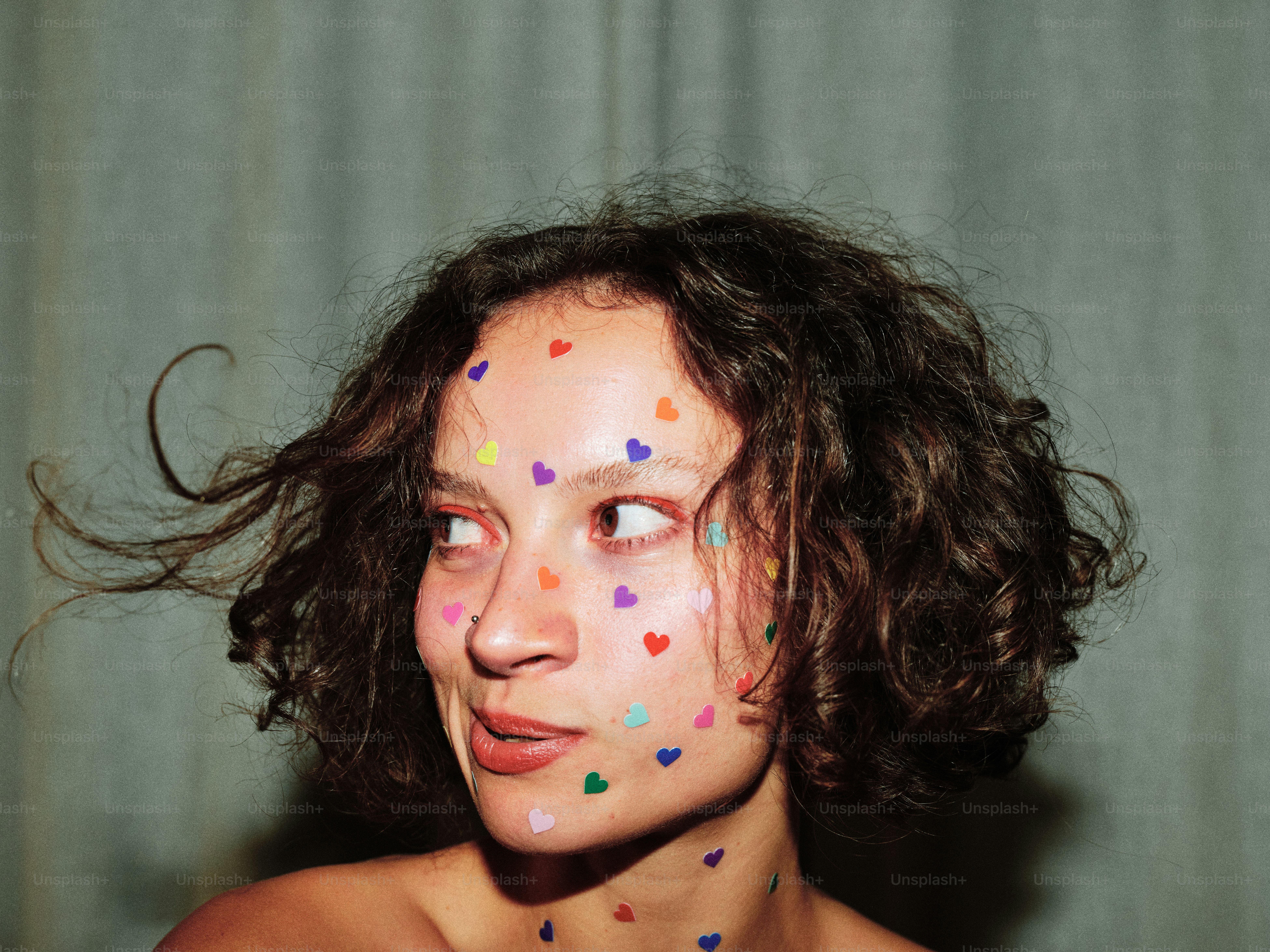 A woman with confetti all over her face