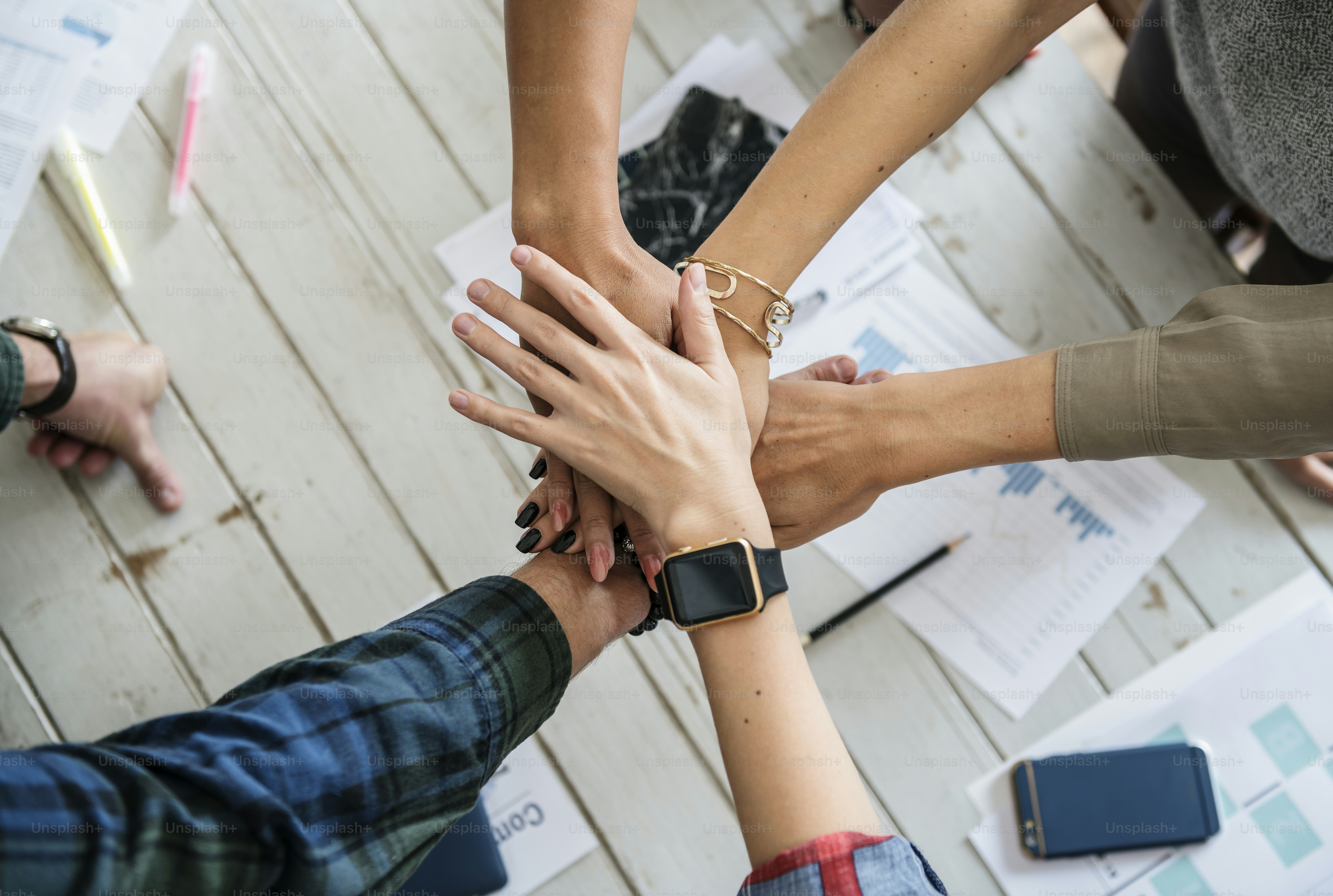 Hands stacking support each other