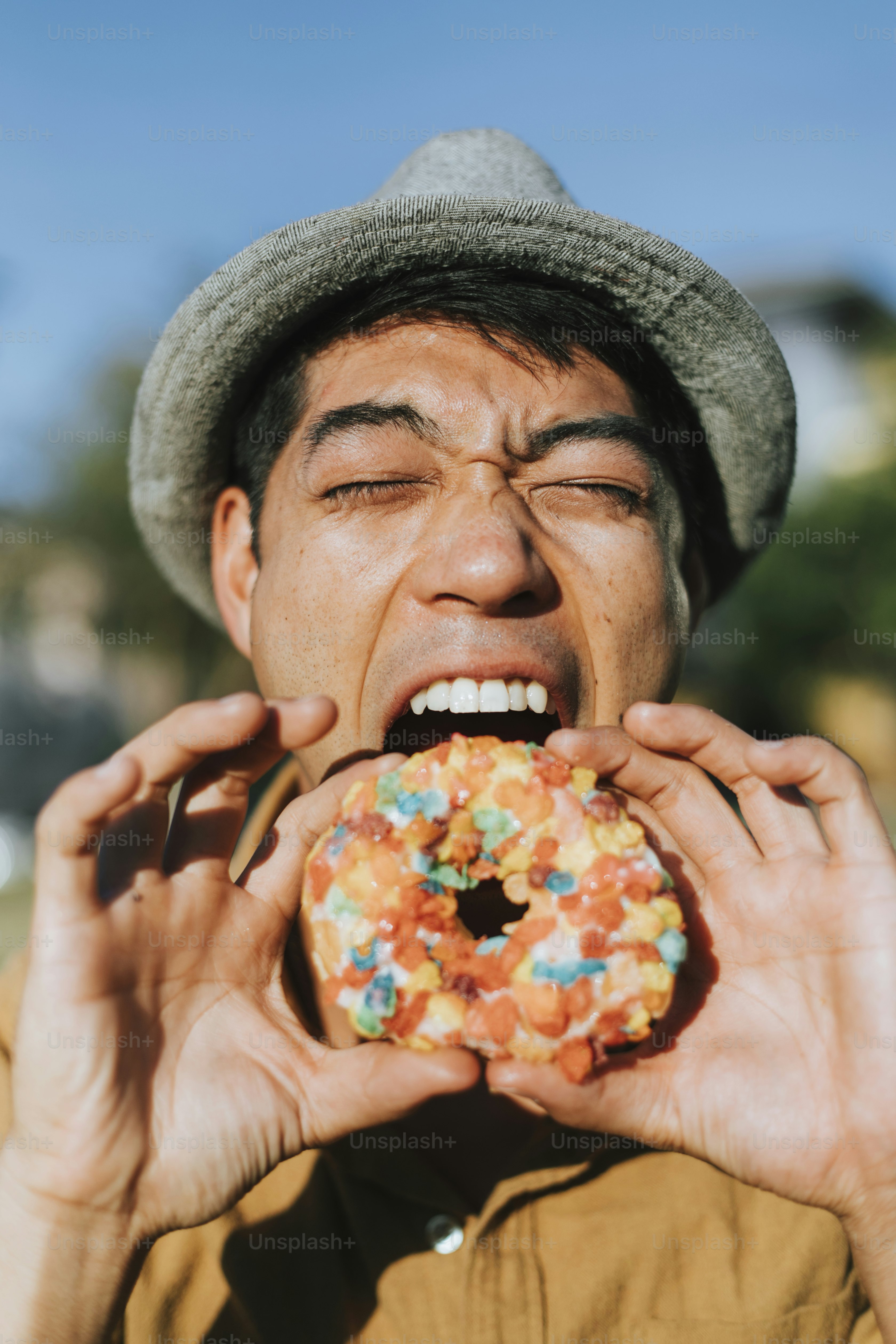 Happy man having a doughnut