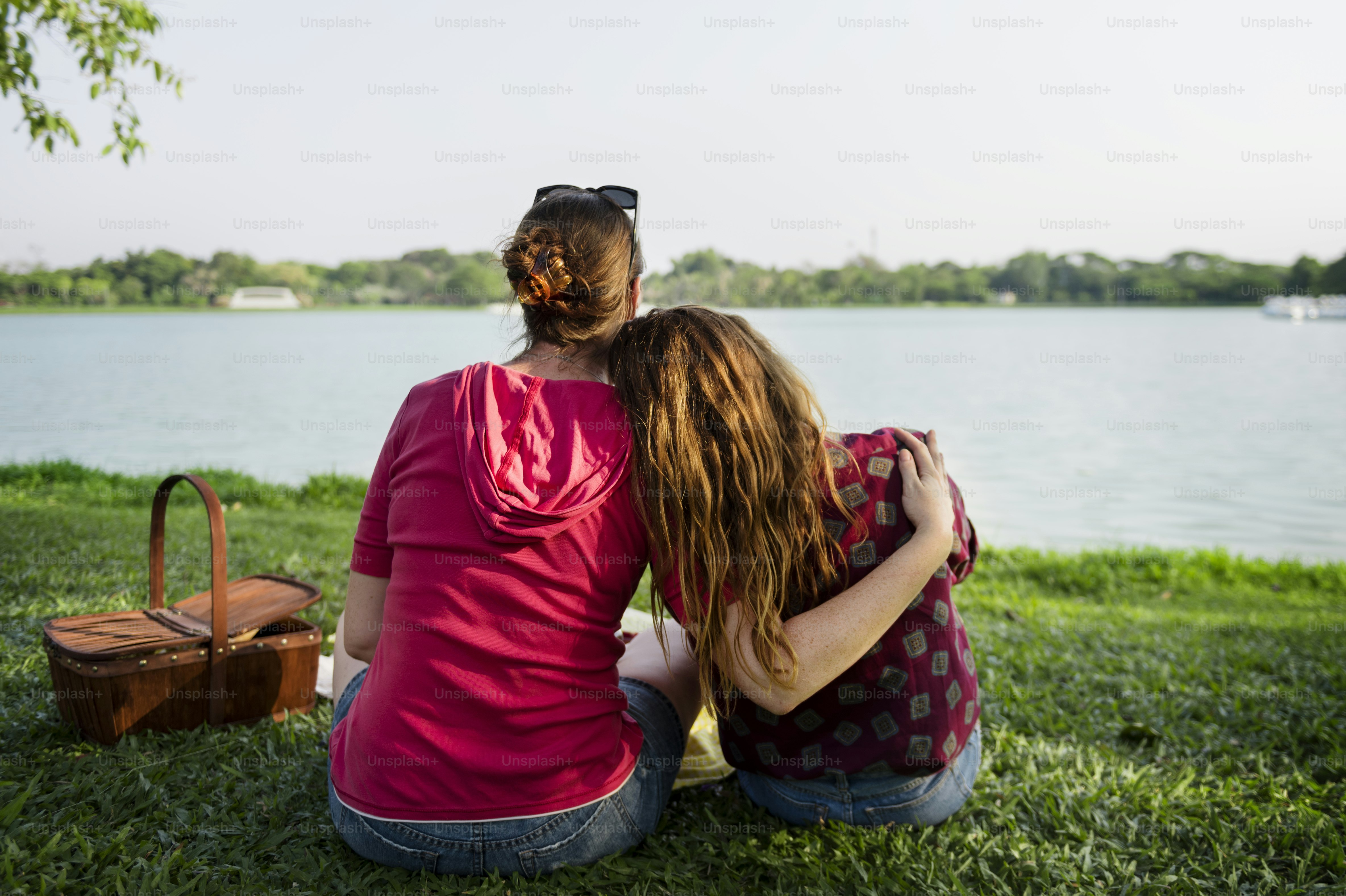 Mother and daughter having a picnic in the park