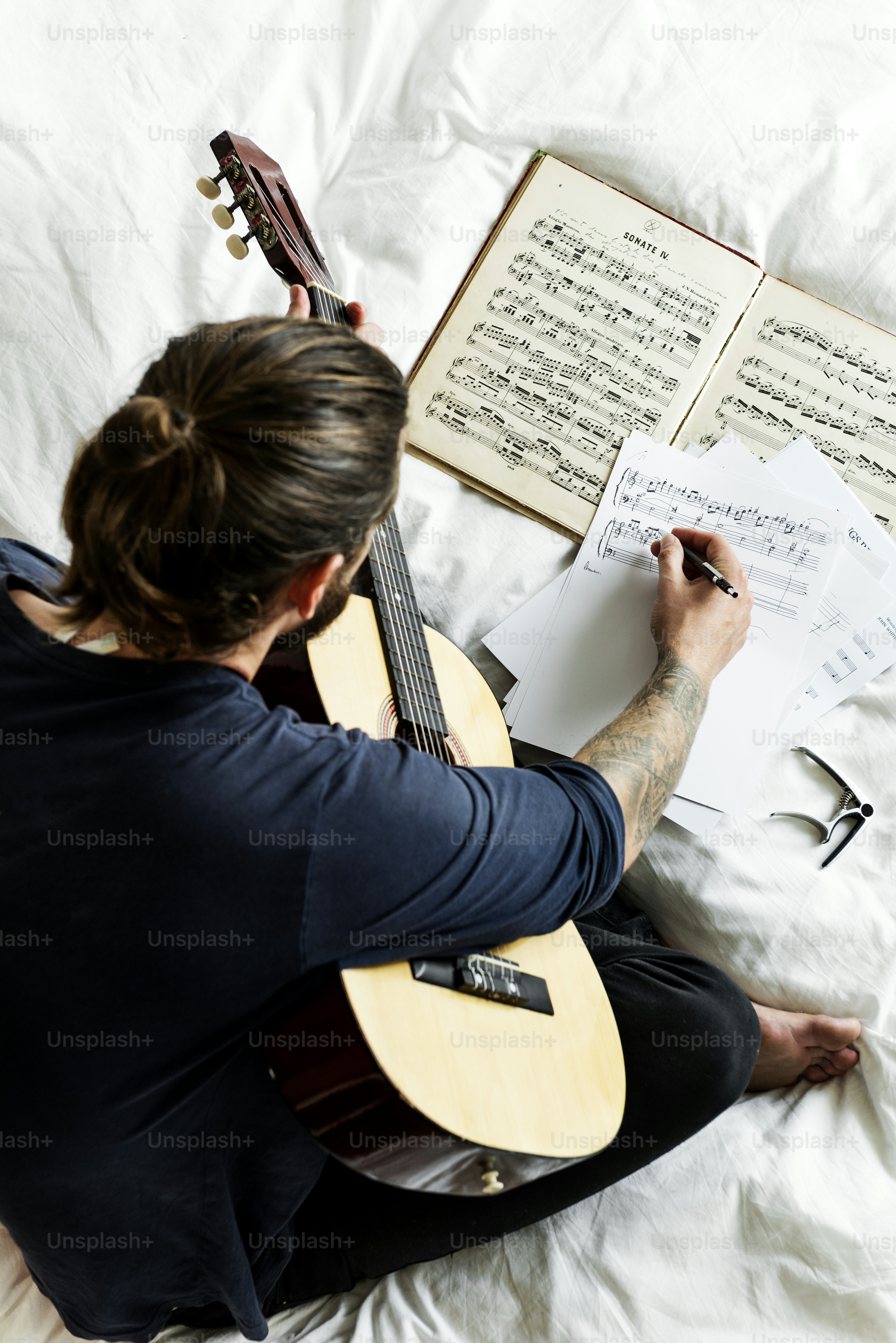 Man Practicing notes with guitar
***These documents are our own generic designs. They do not infringe on any copyrighted designs.