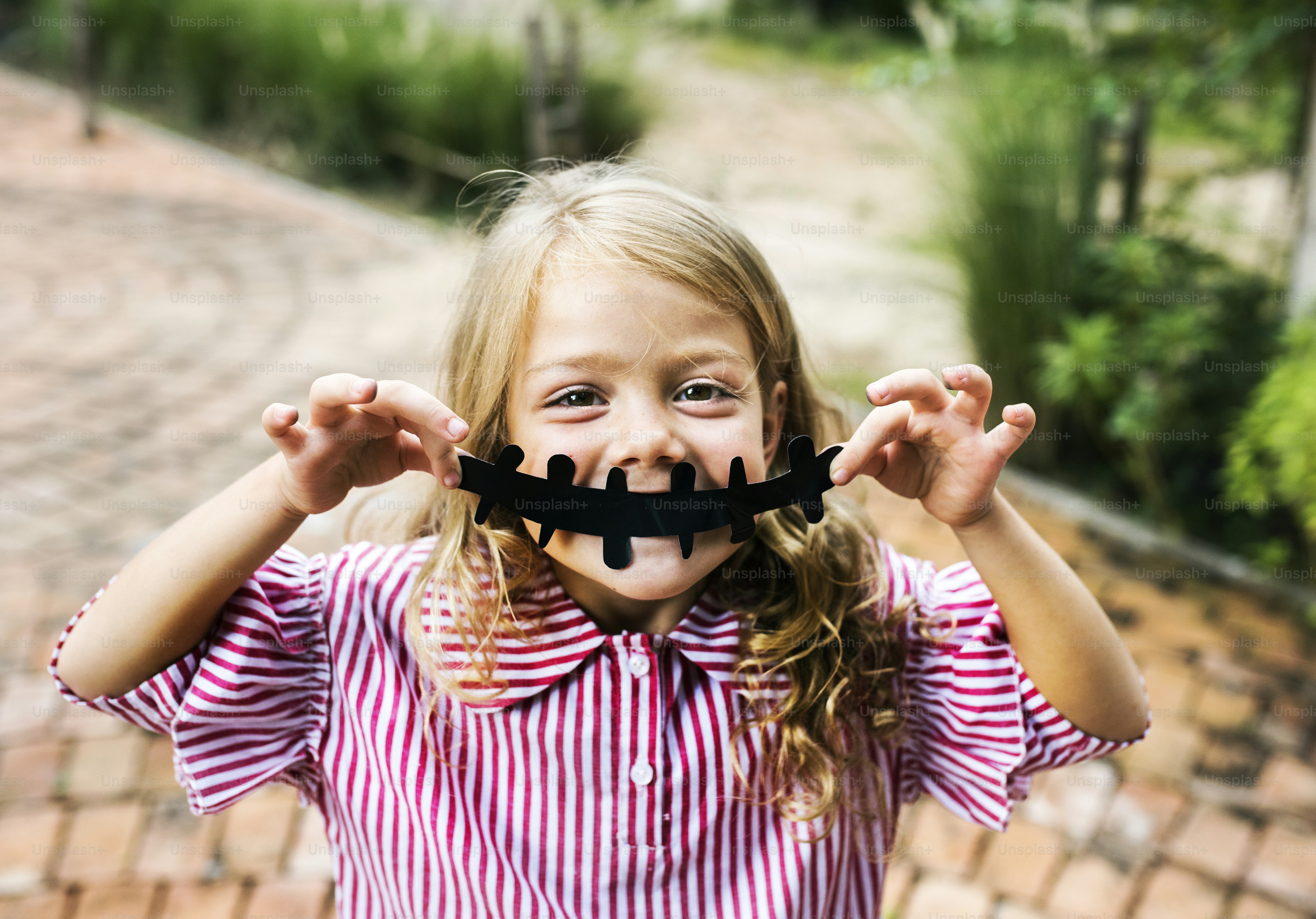 Young playful girl enjoying Halloween
