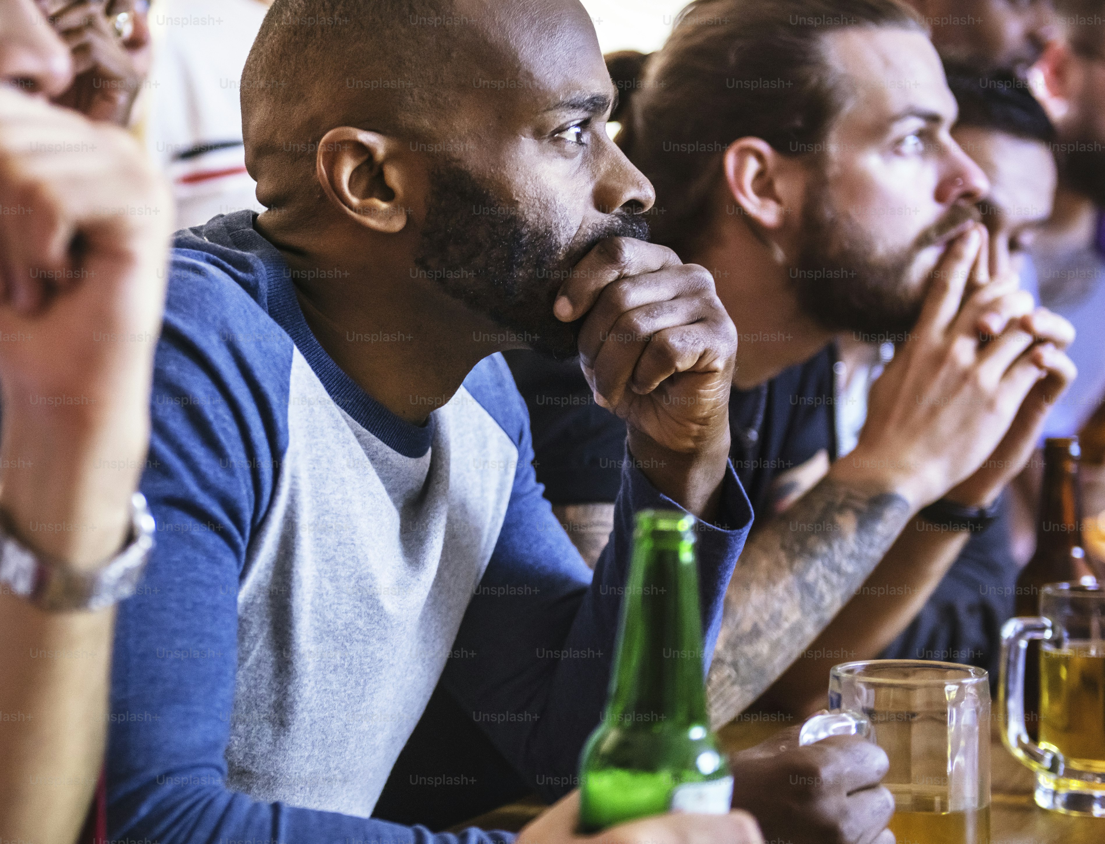 Friends cheering sport at bar together