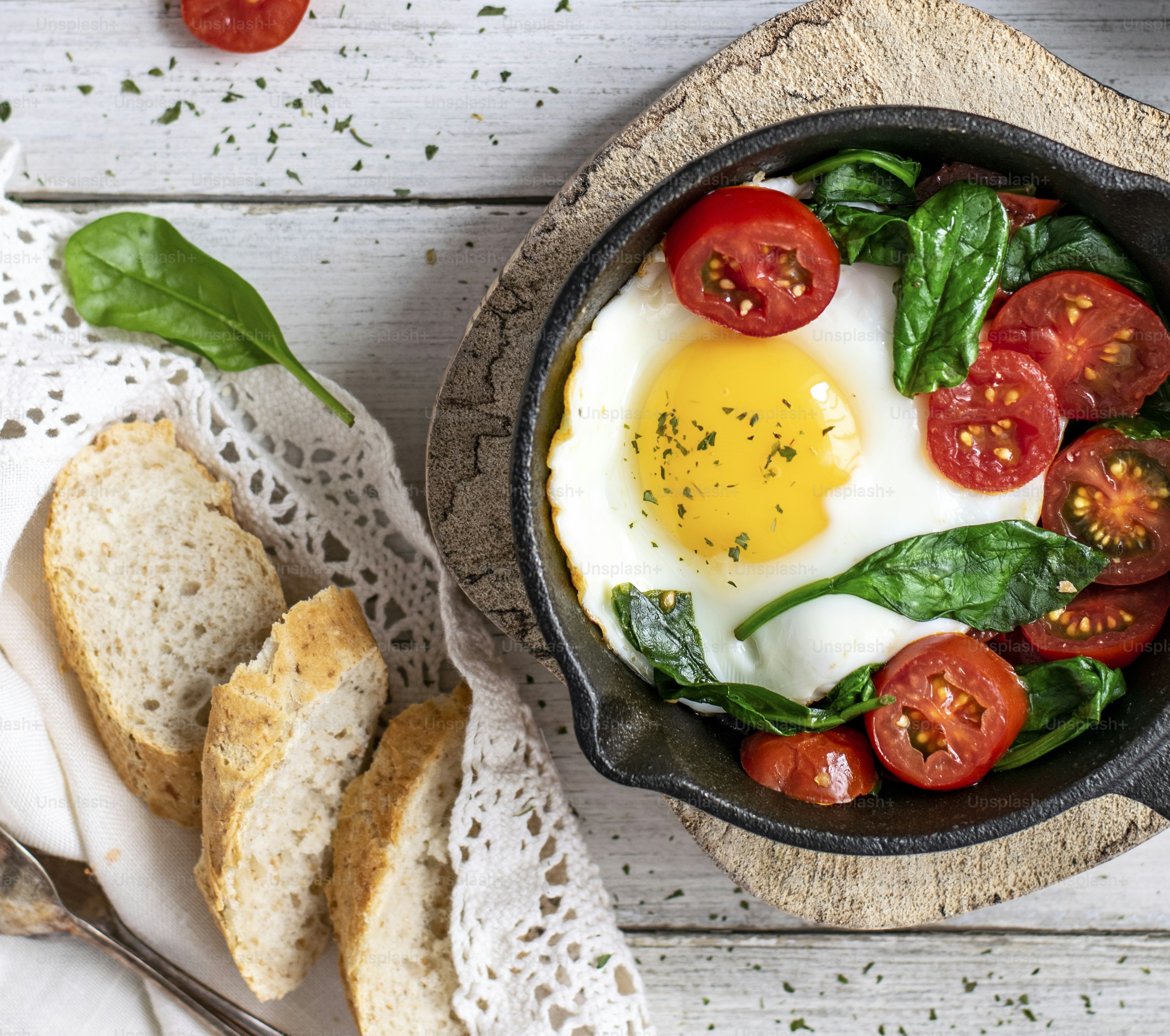 Freshly cooked egg and tomatoes in a pan