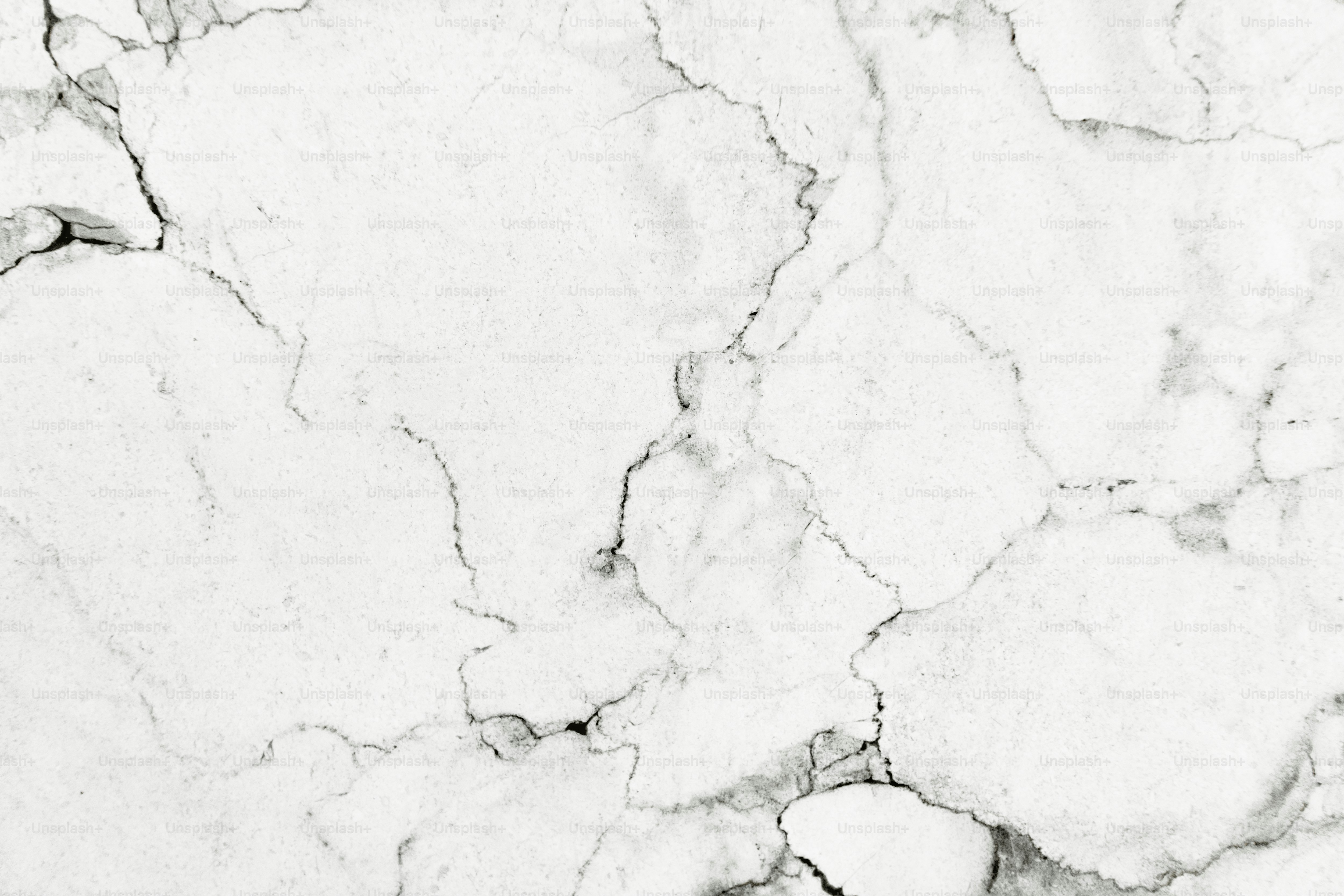 Textura de pared estampada de mármol blanco