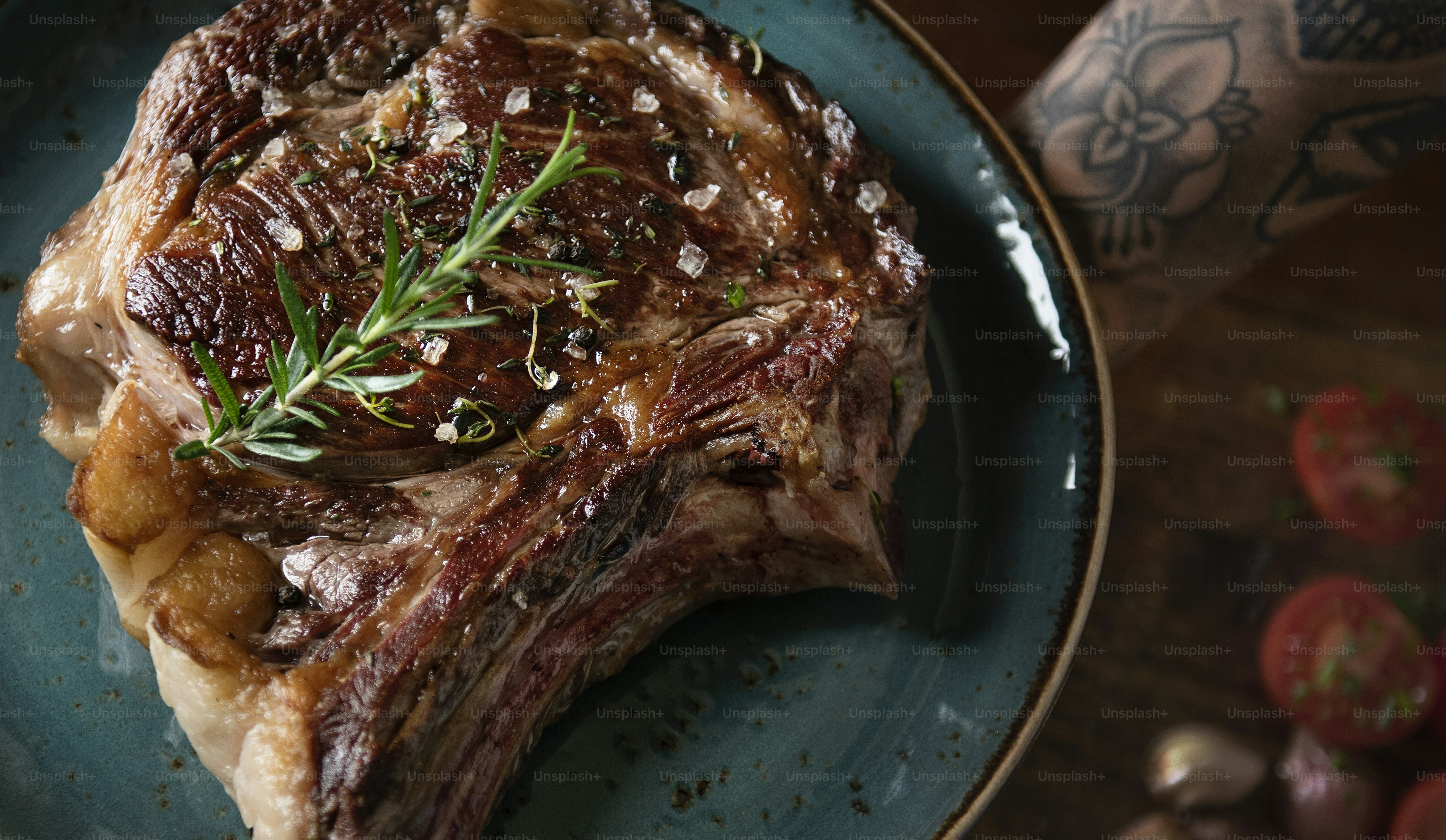 Tomahawk on a plate with garnish food photography recipe idea