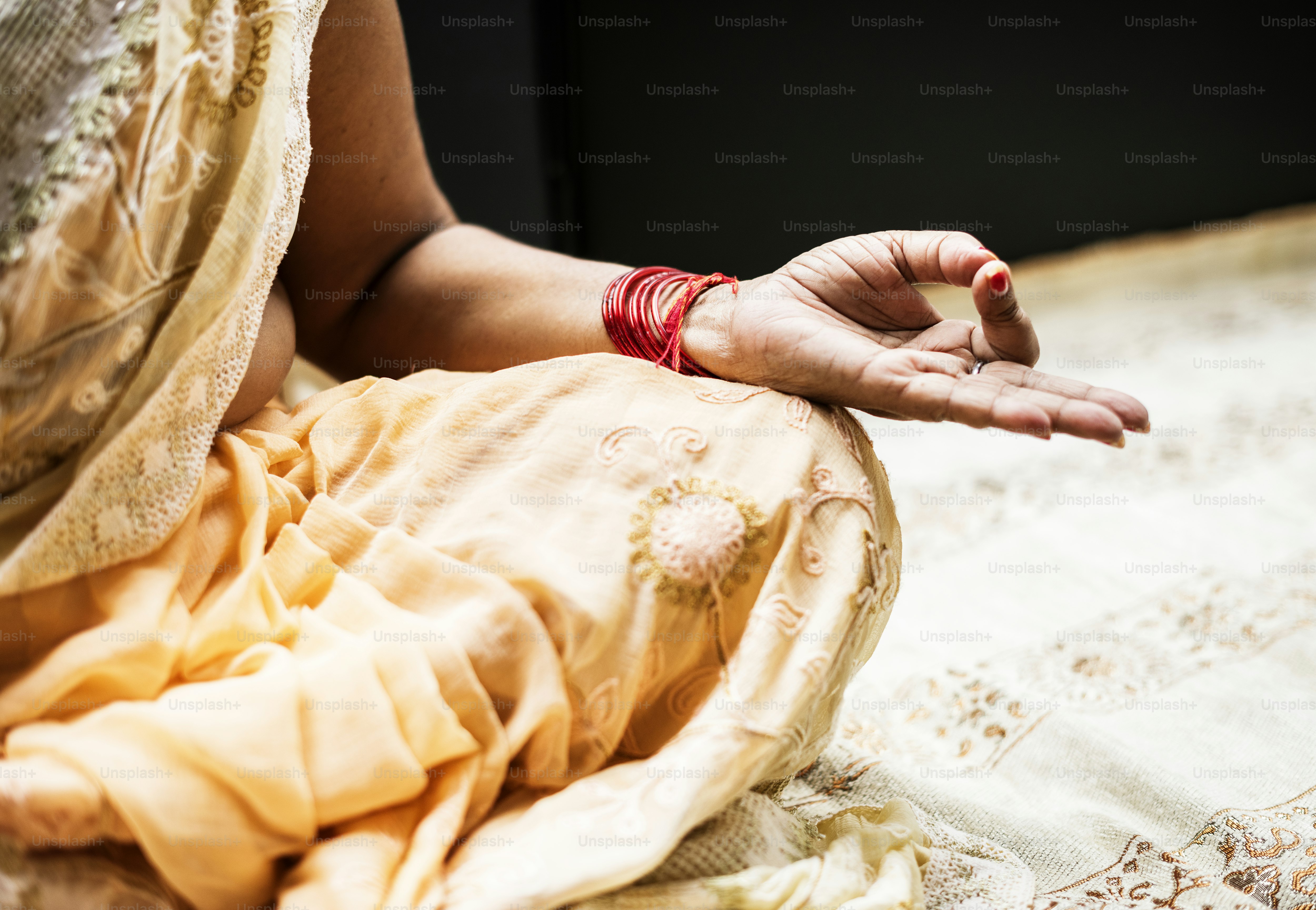 Traveler practicing Ayurveda stress treatment India meditation session outdoors