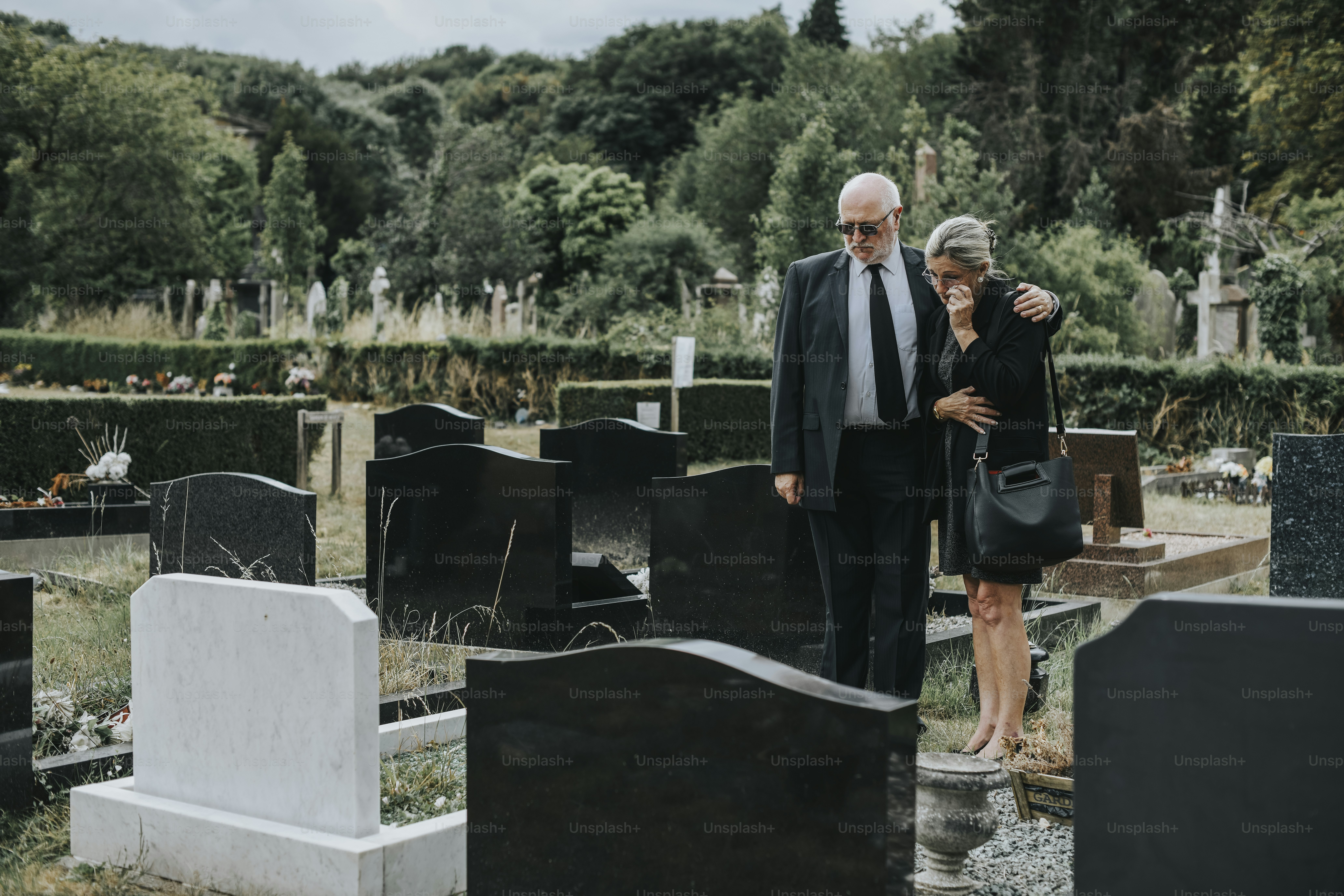 Husband trying to comfort his wife due to her loss