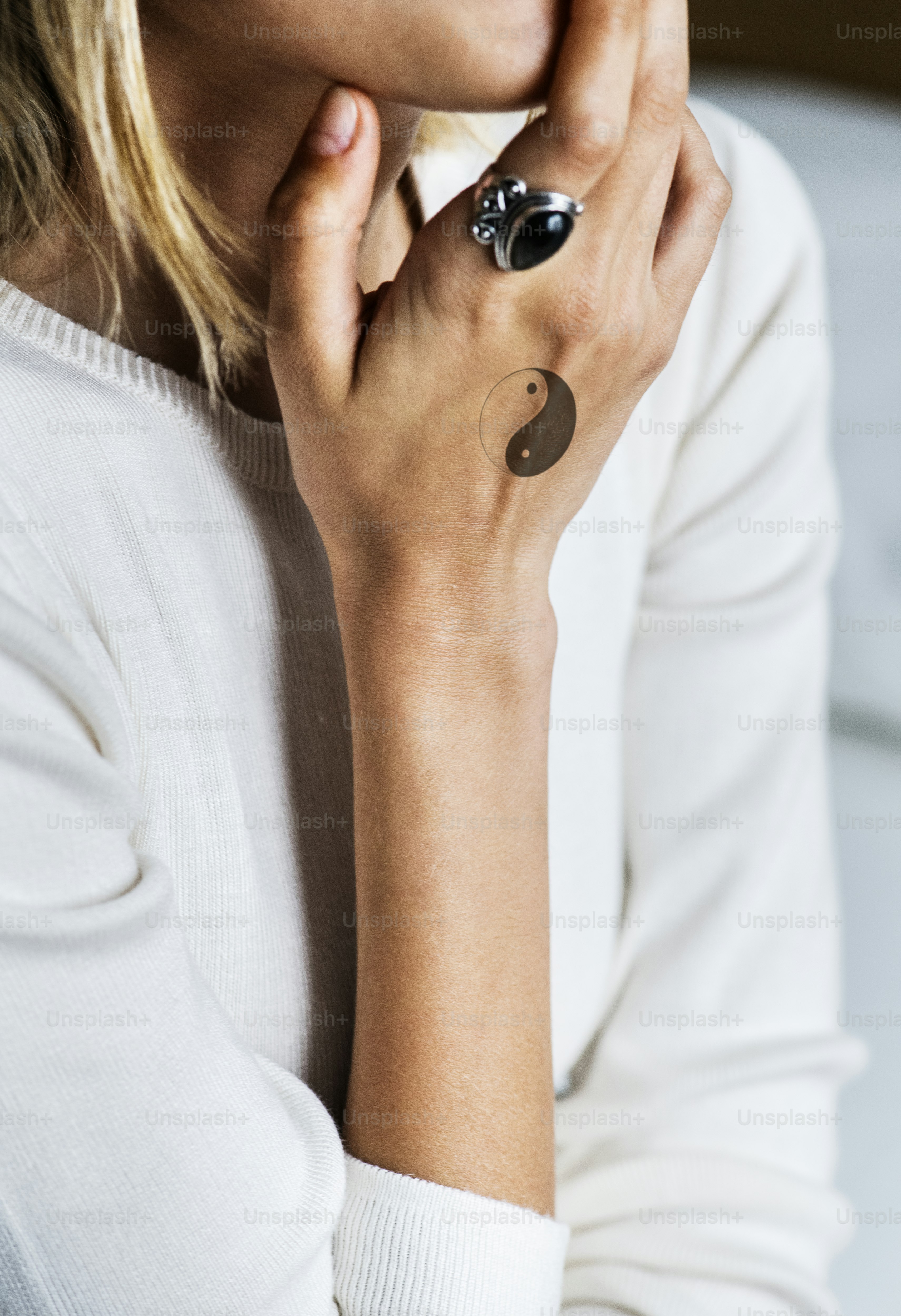 Closeup of hand tattoo of a woman