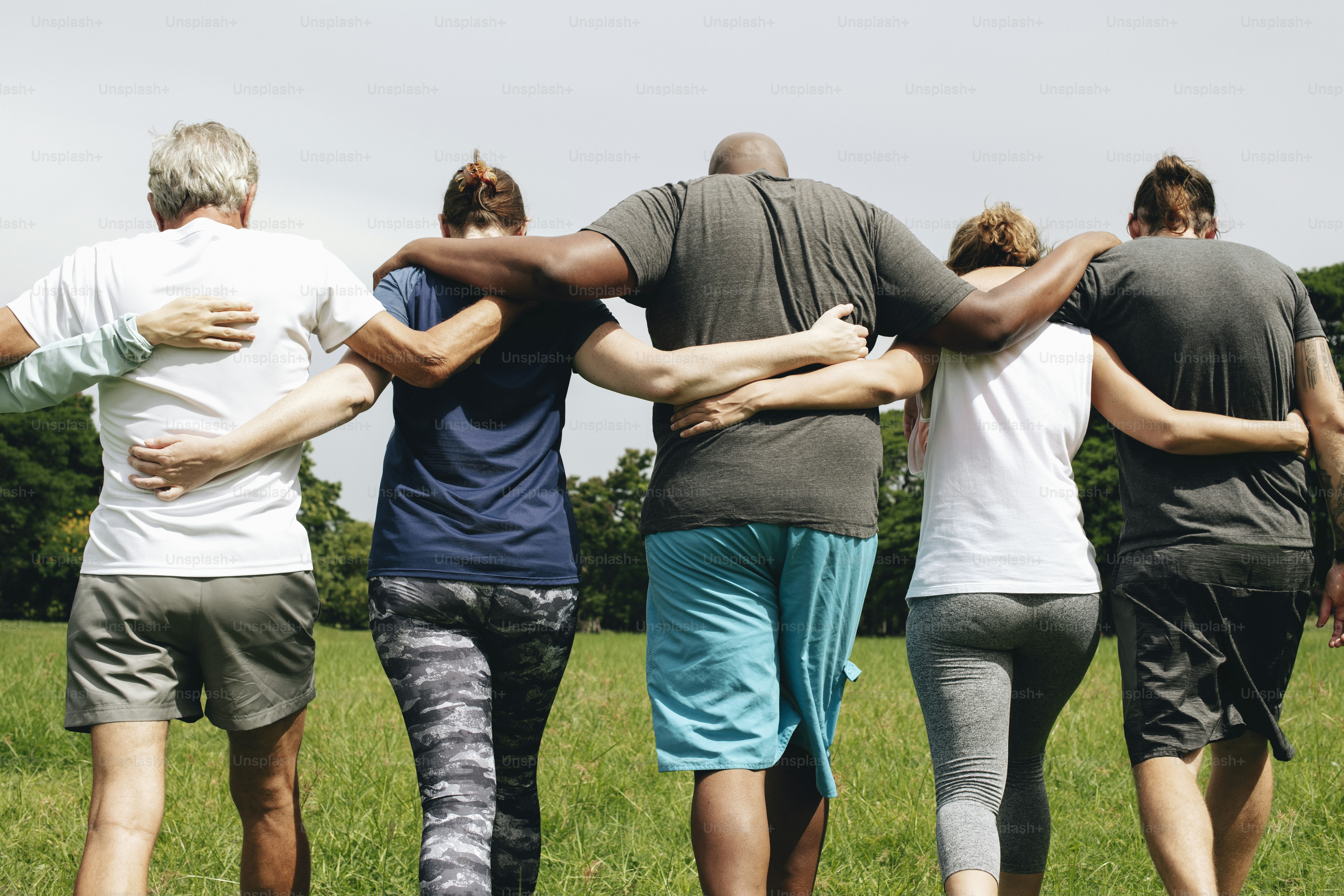 Group of people hugging in the park