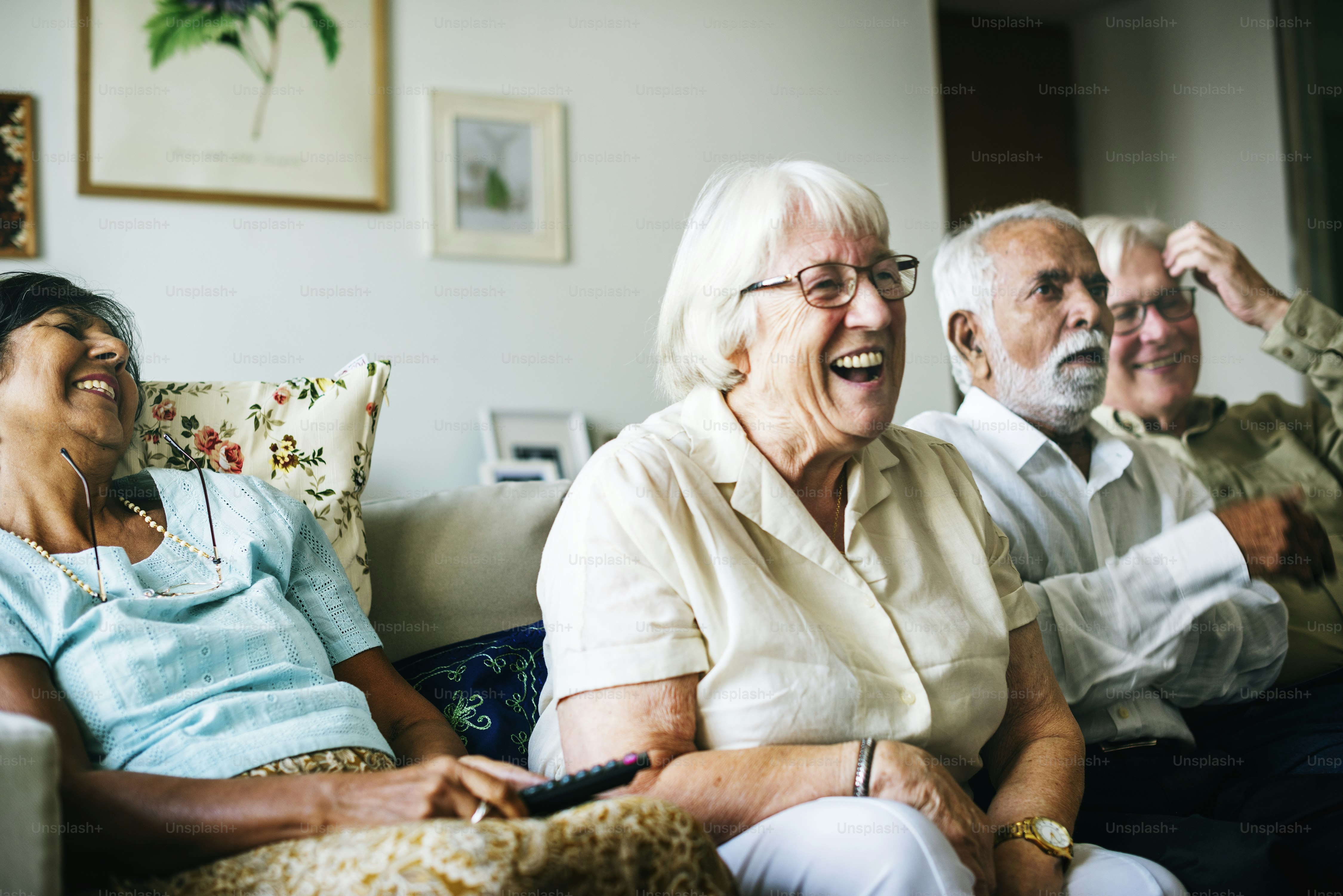 Senior people watching television together
**Documentation proving the source is available in the public domain***