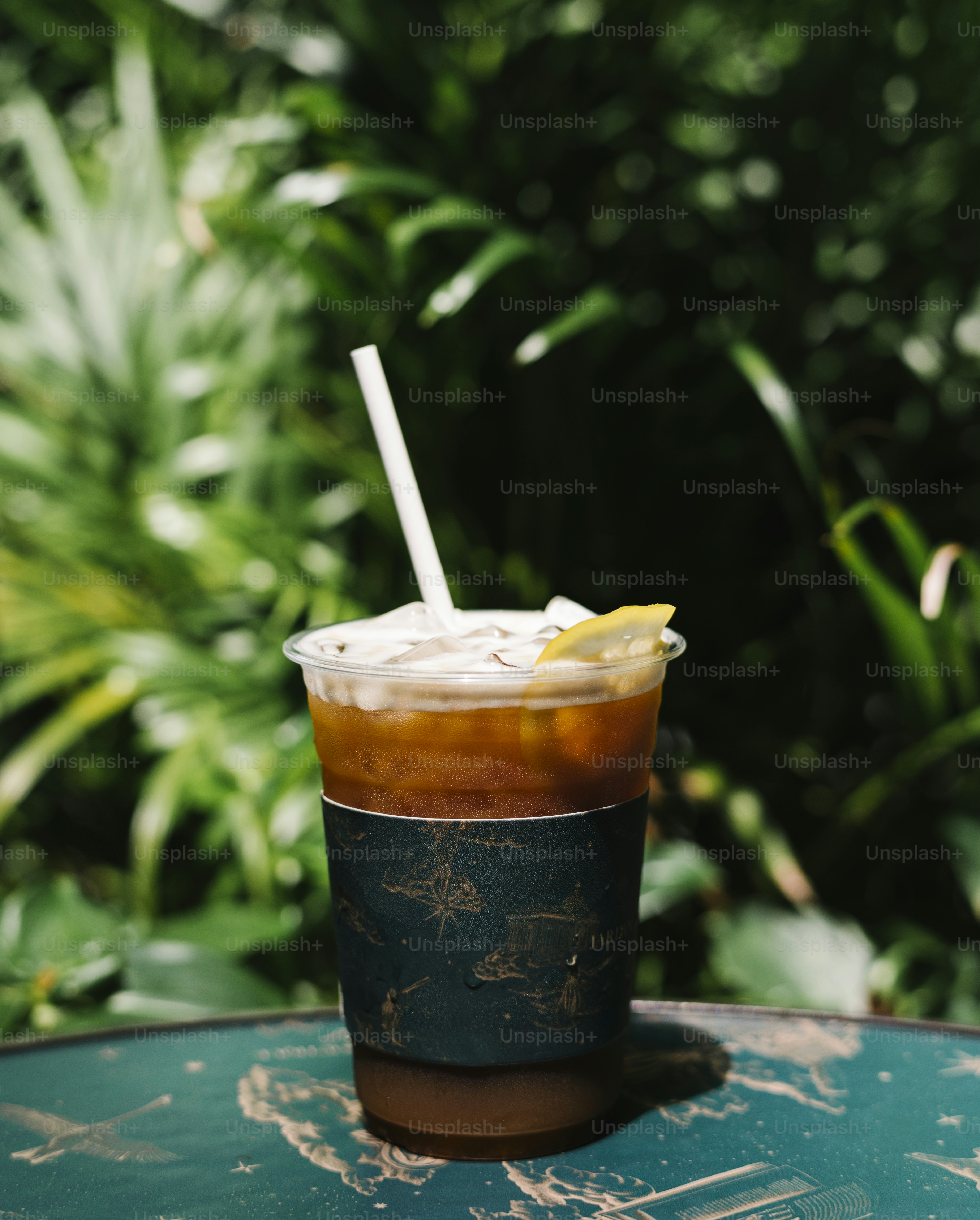 Iced cold brew coffee with lemon on a table