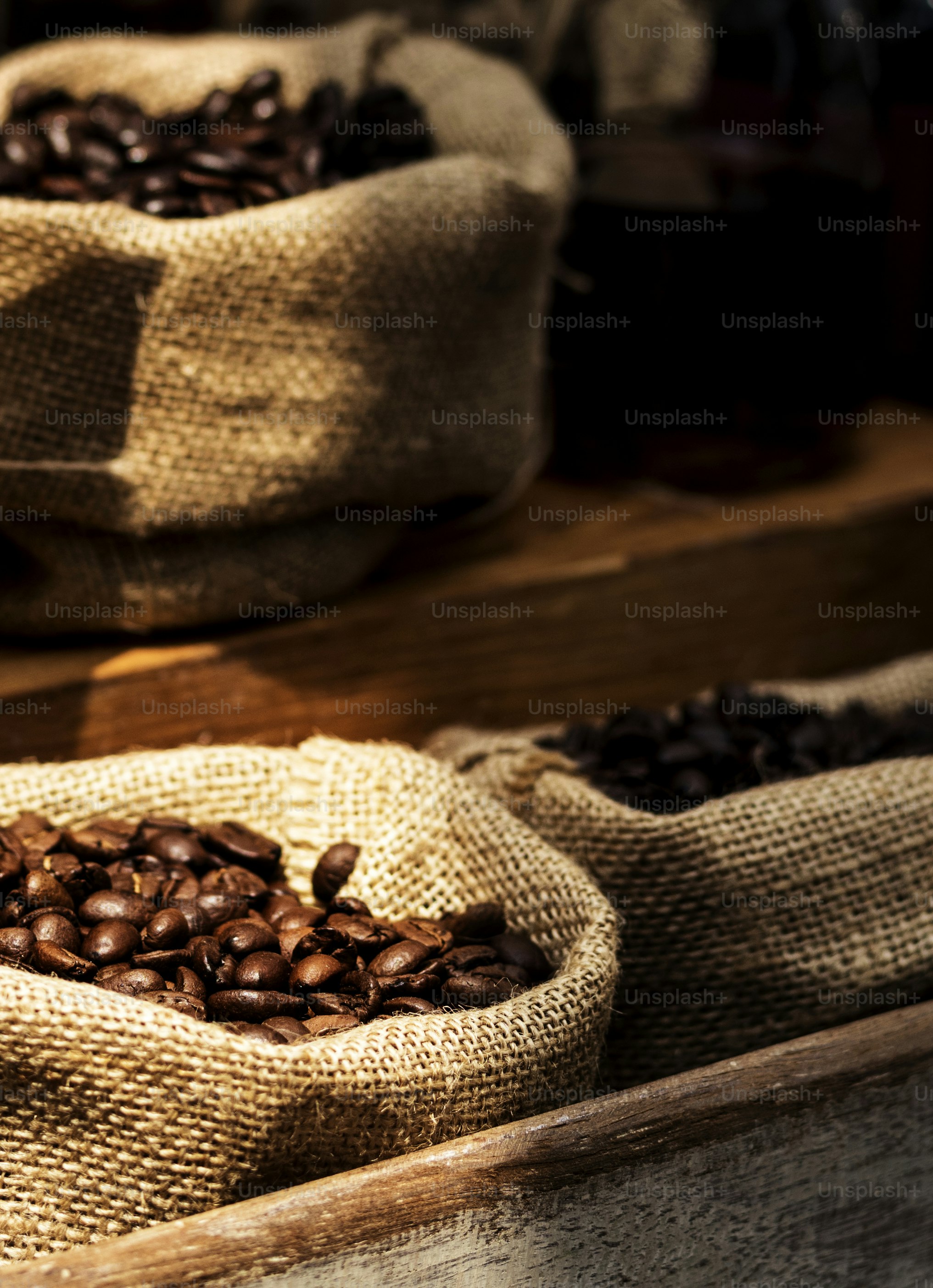 Freshly roasted coffee beans in sacks