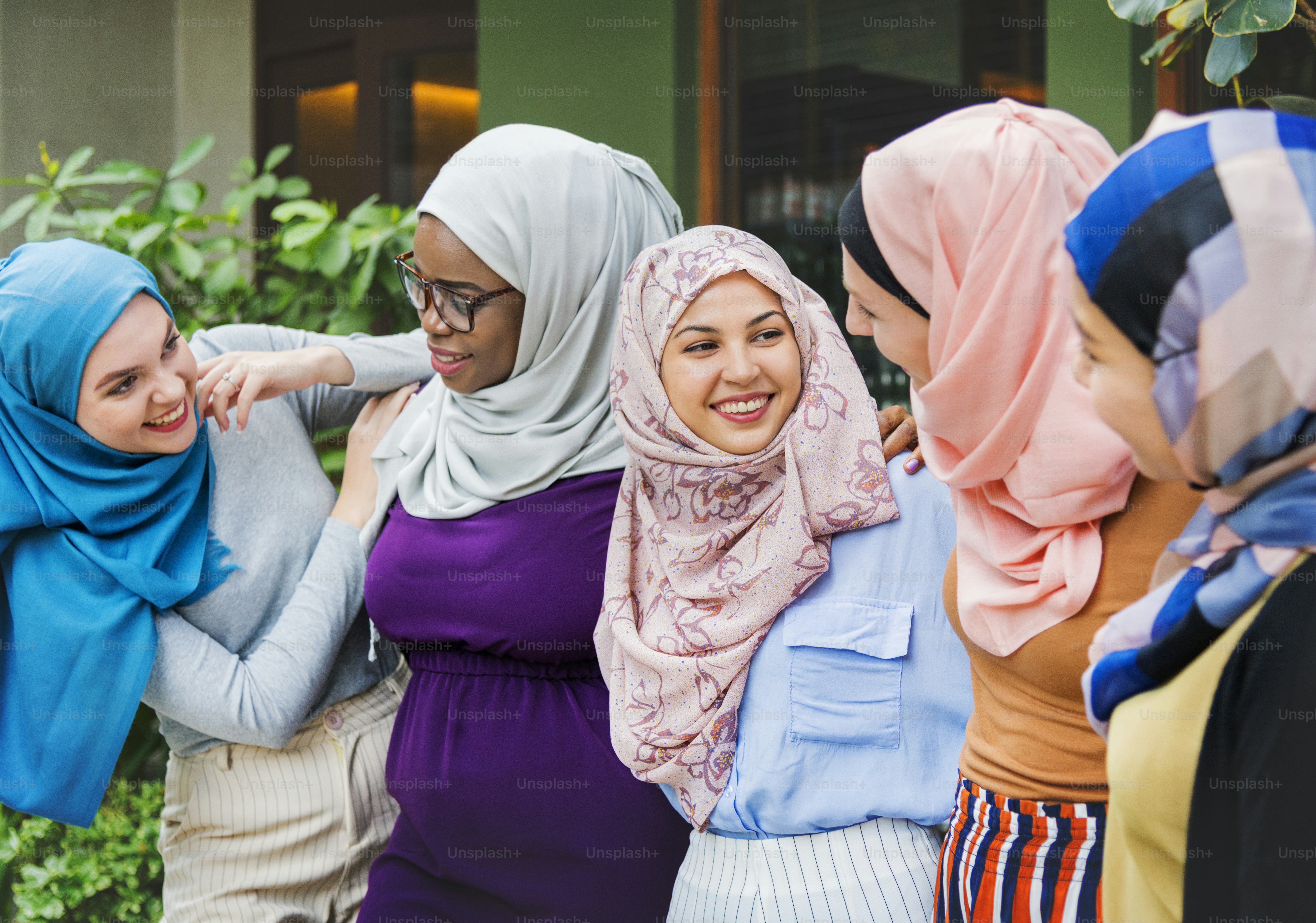 Group of islamic friends arms around and smiling together photo – Adult ...