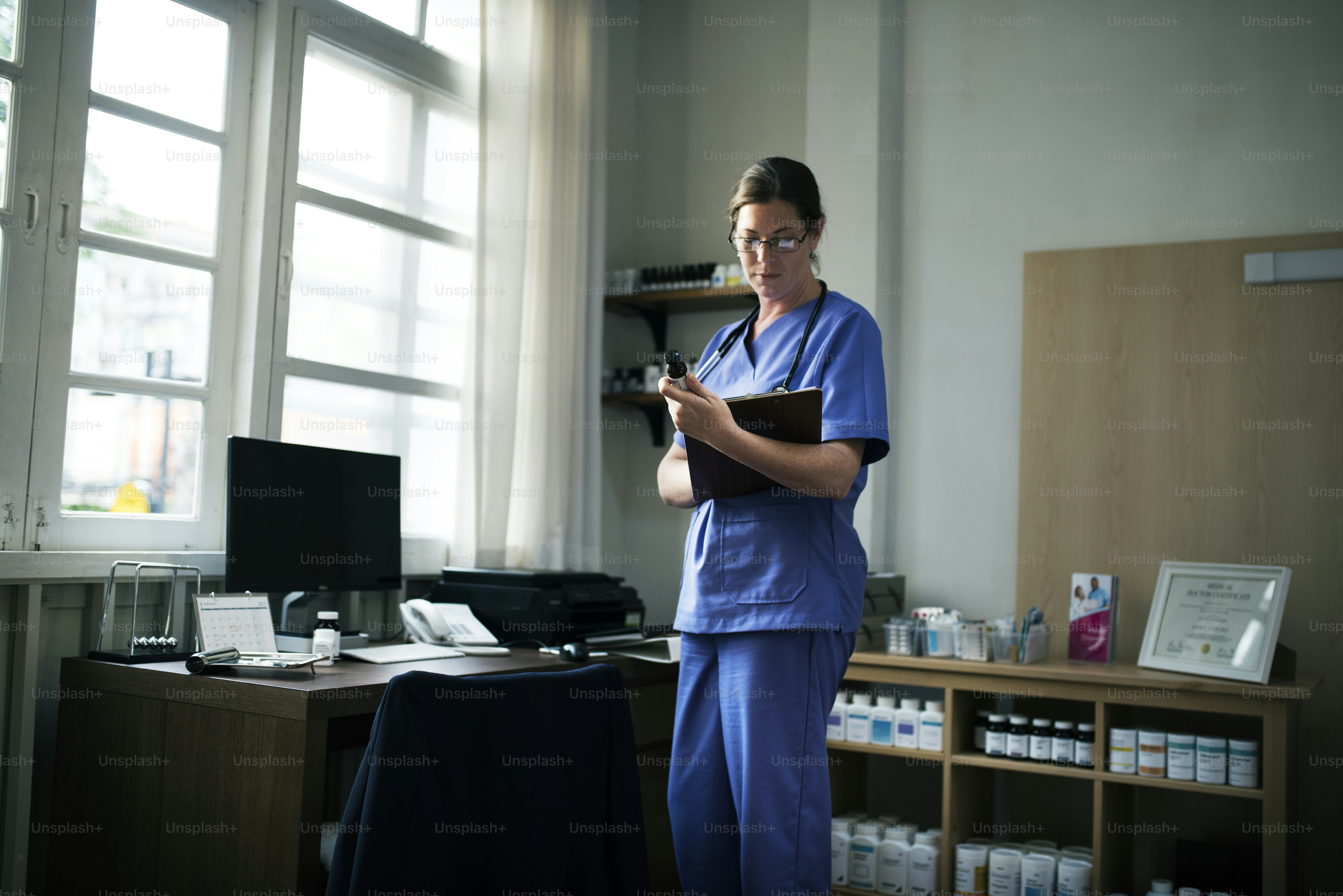 A doctor checking medicine stock photo – Doctor Image on Unsplash