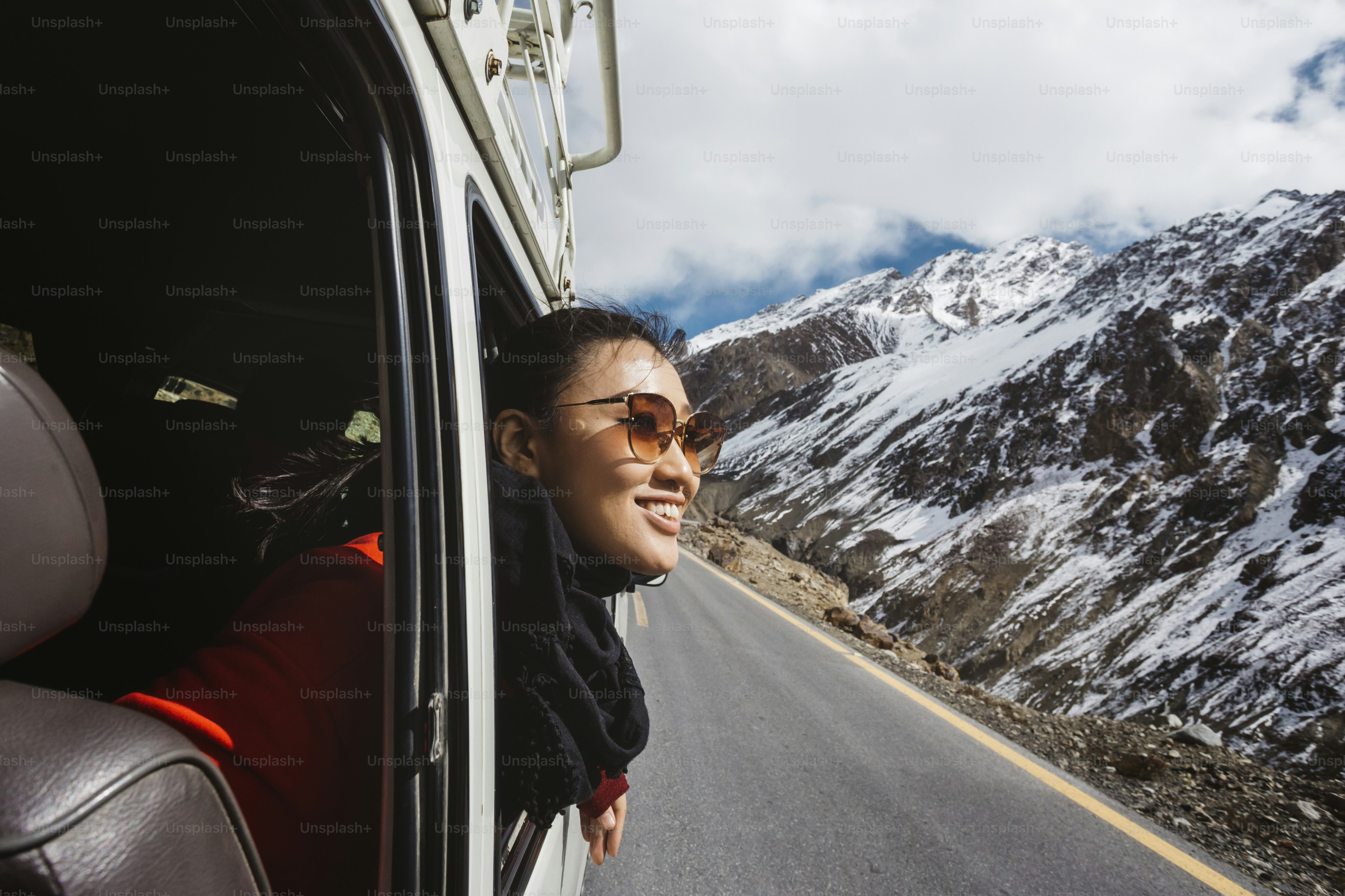 Woman in a van enjoying cool breeze