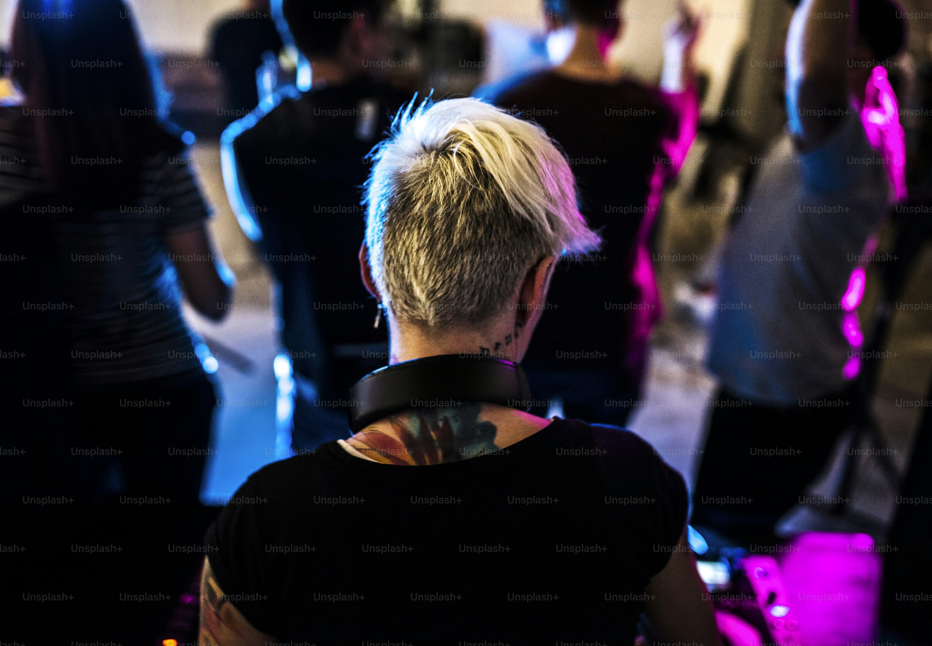 Caucasian DJ with tattoo is on a station