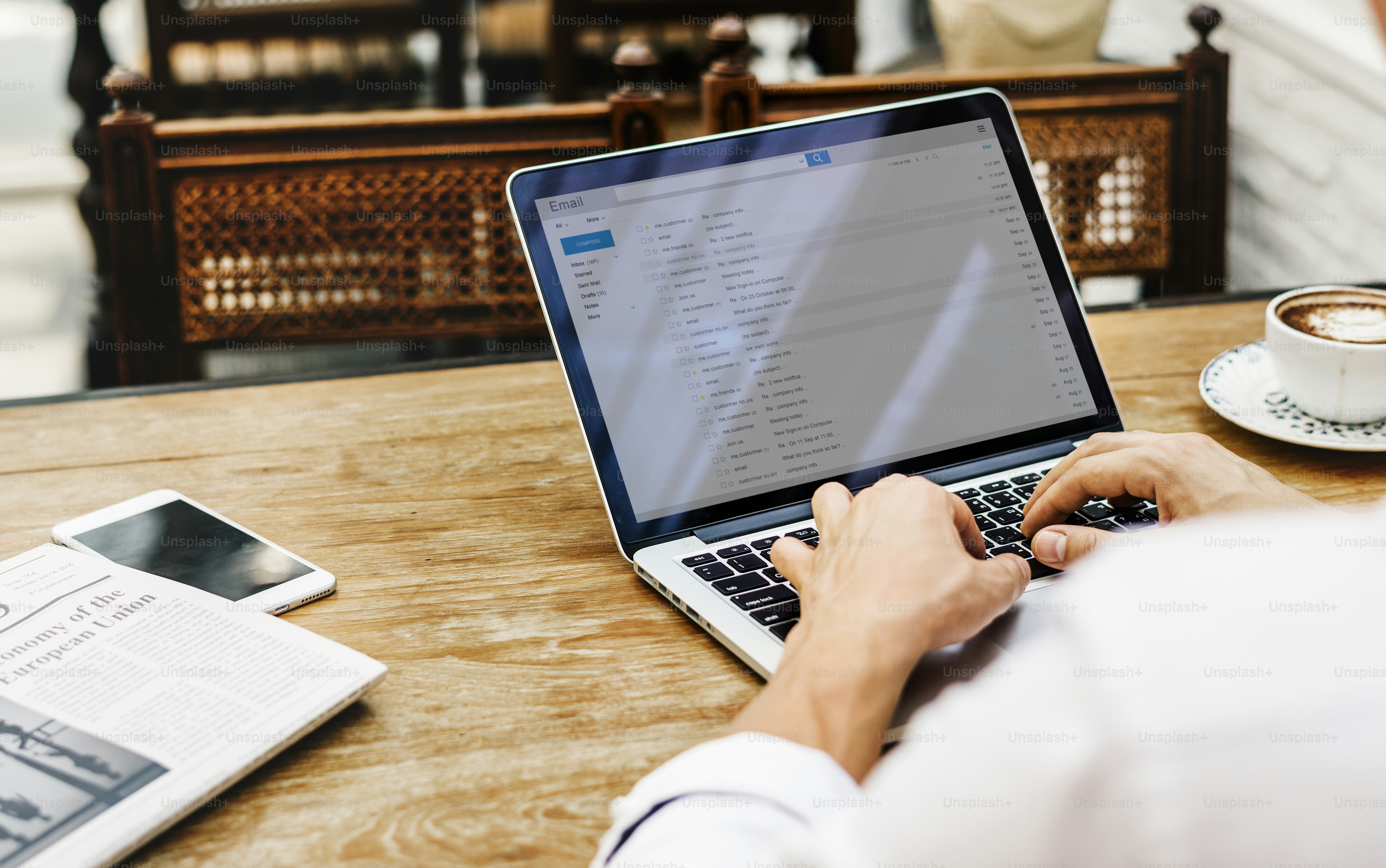 Backpacker managing long-term travel budget on laptop spreadsheet