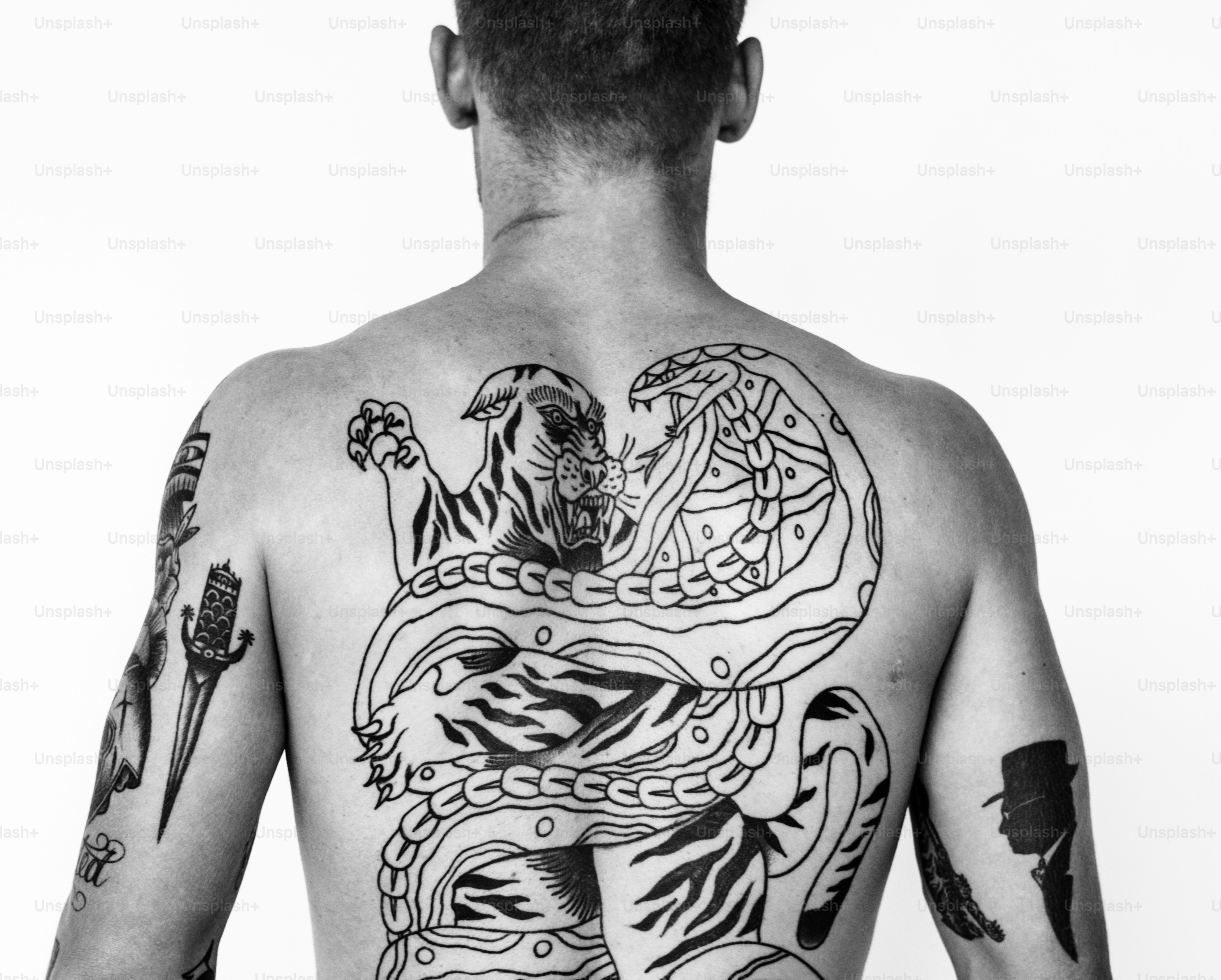 A man full of tattoos