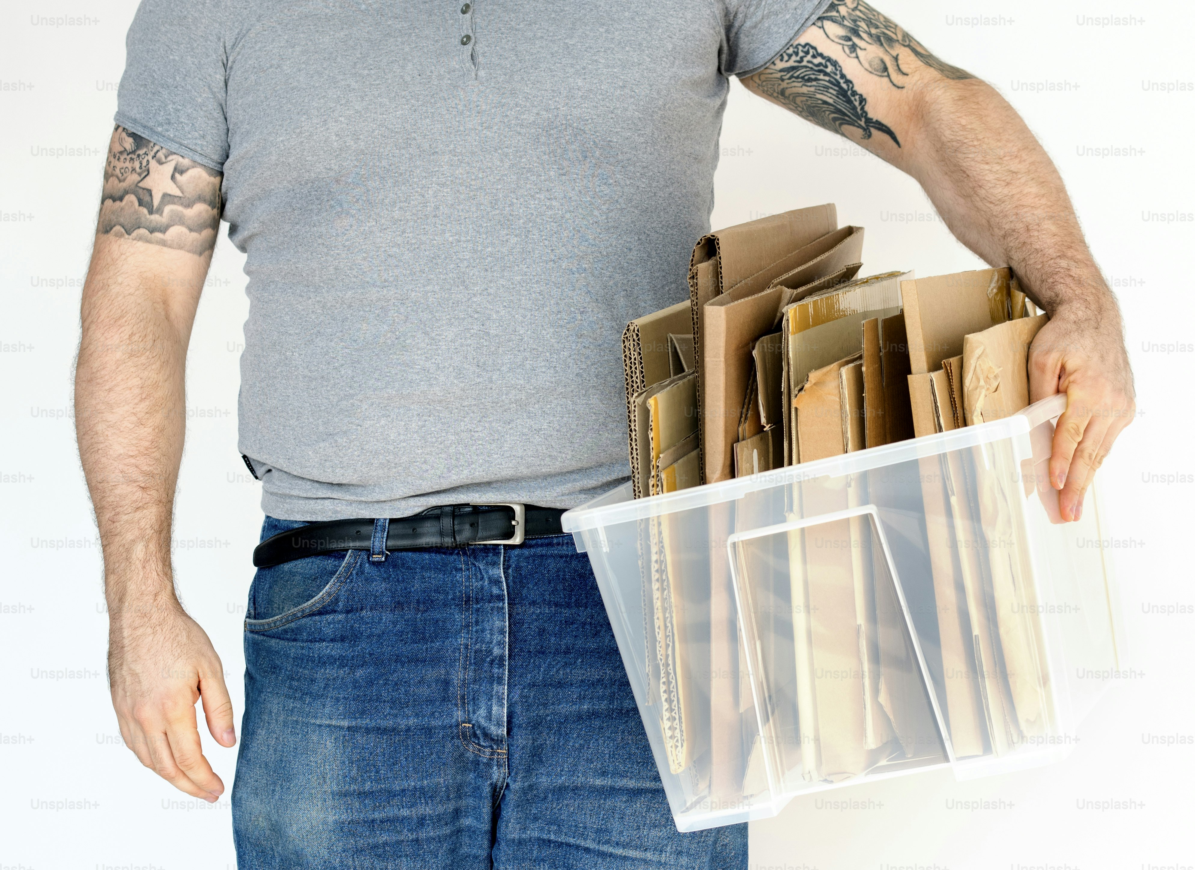 Man standing and holding box of cardboard