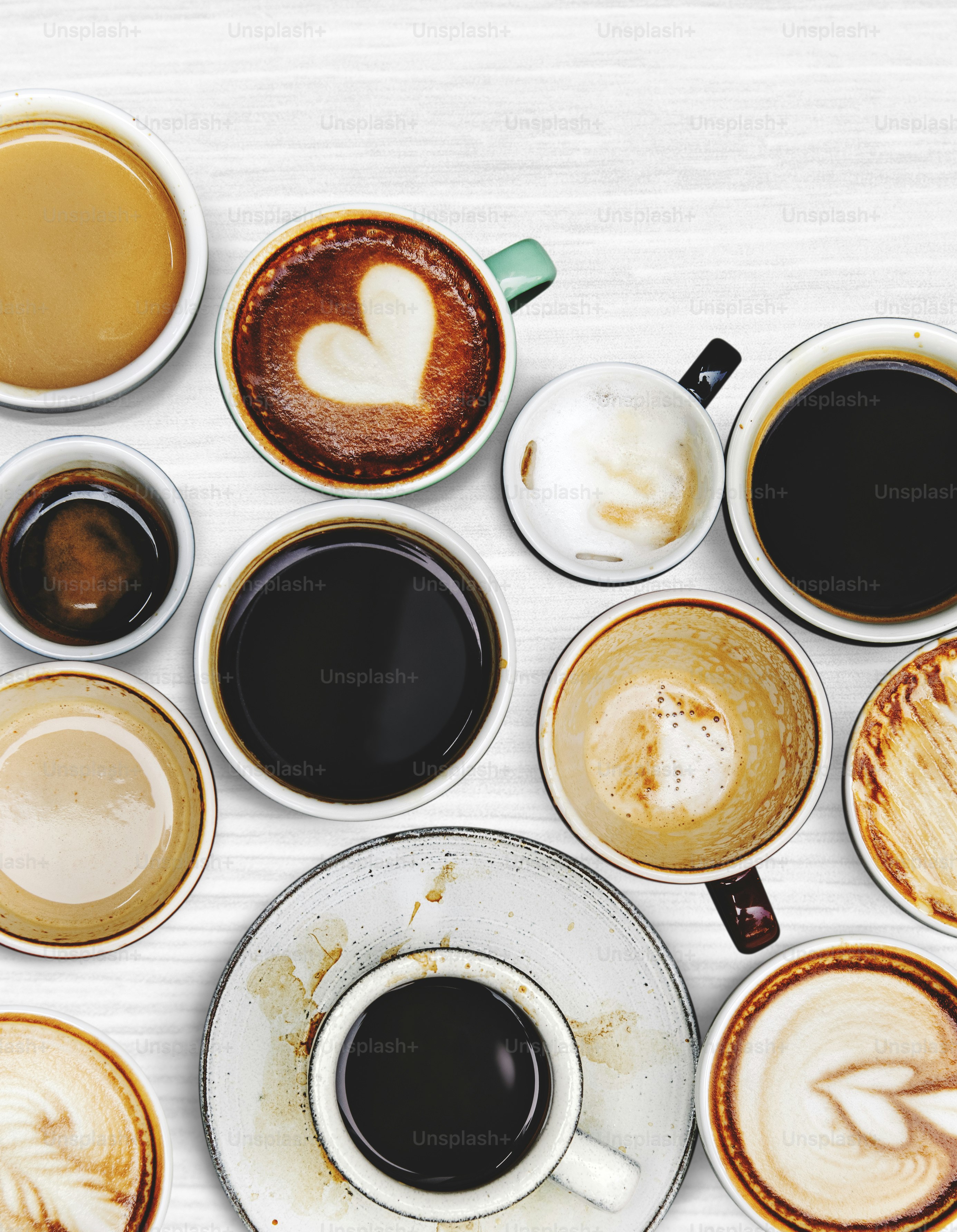 Assorted coffee cups on a textured background