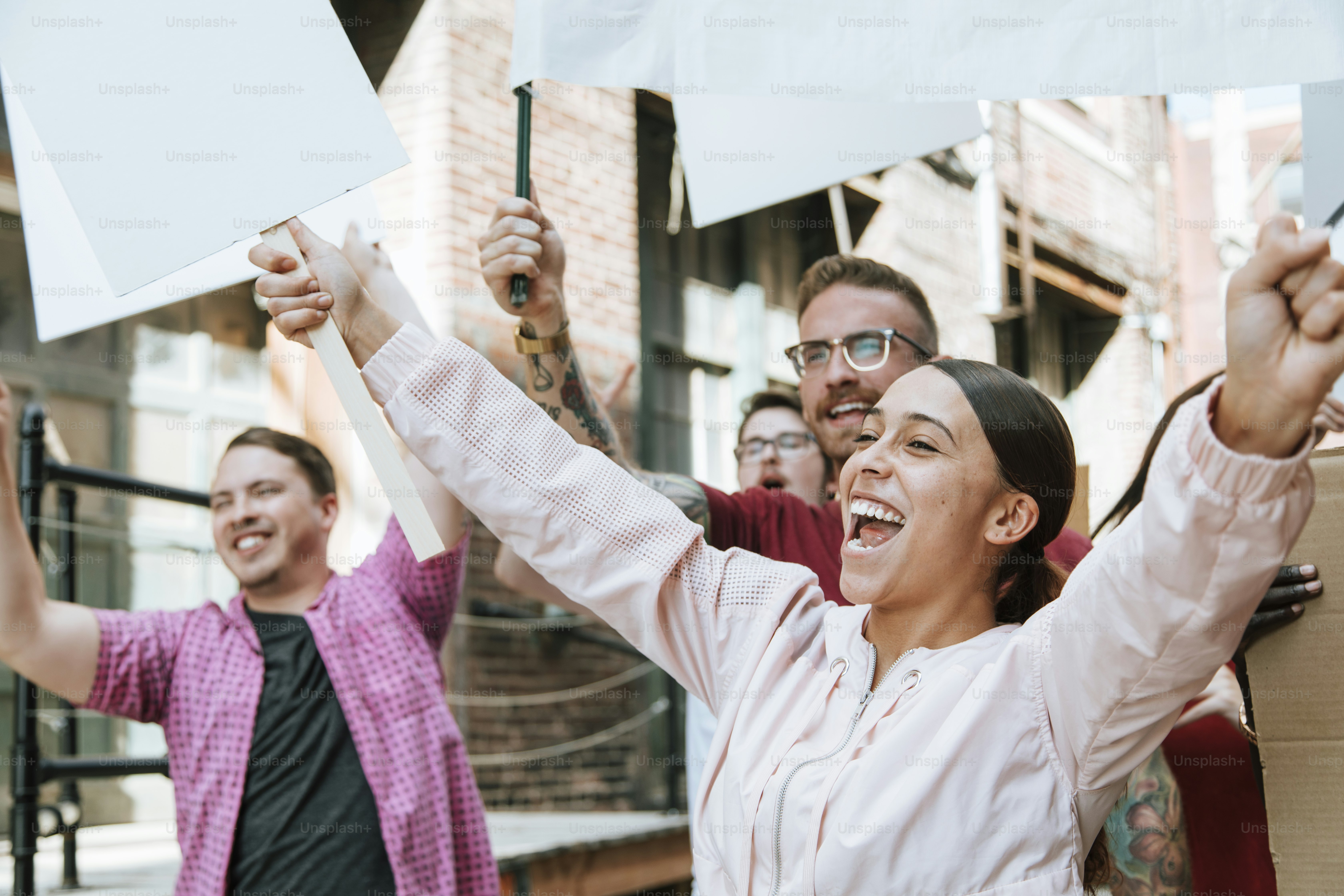 Colorful protesters marching through a city