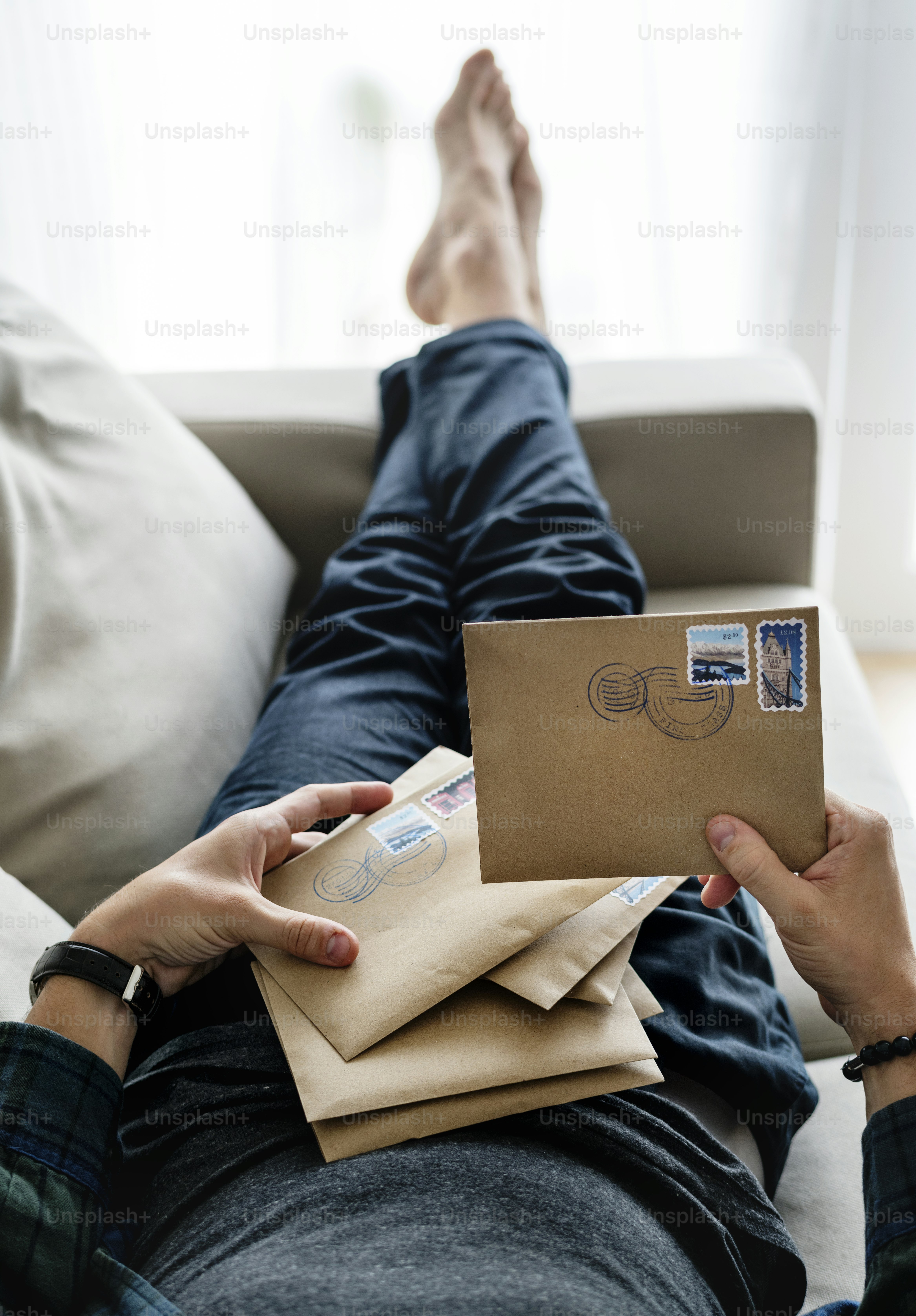 Aerial view of a man sorting an envelope