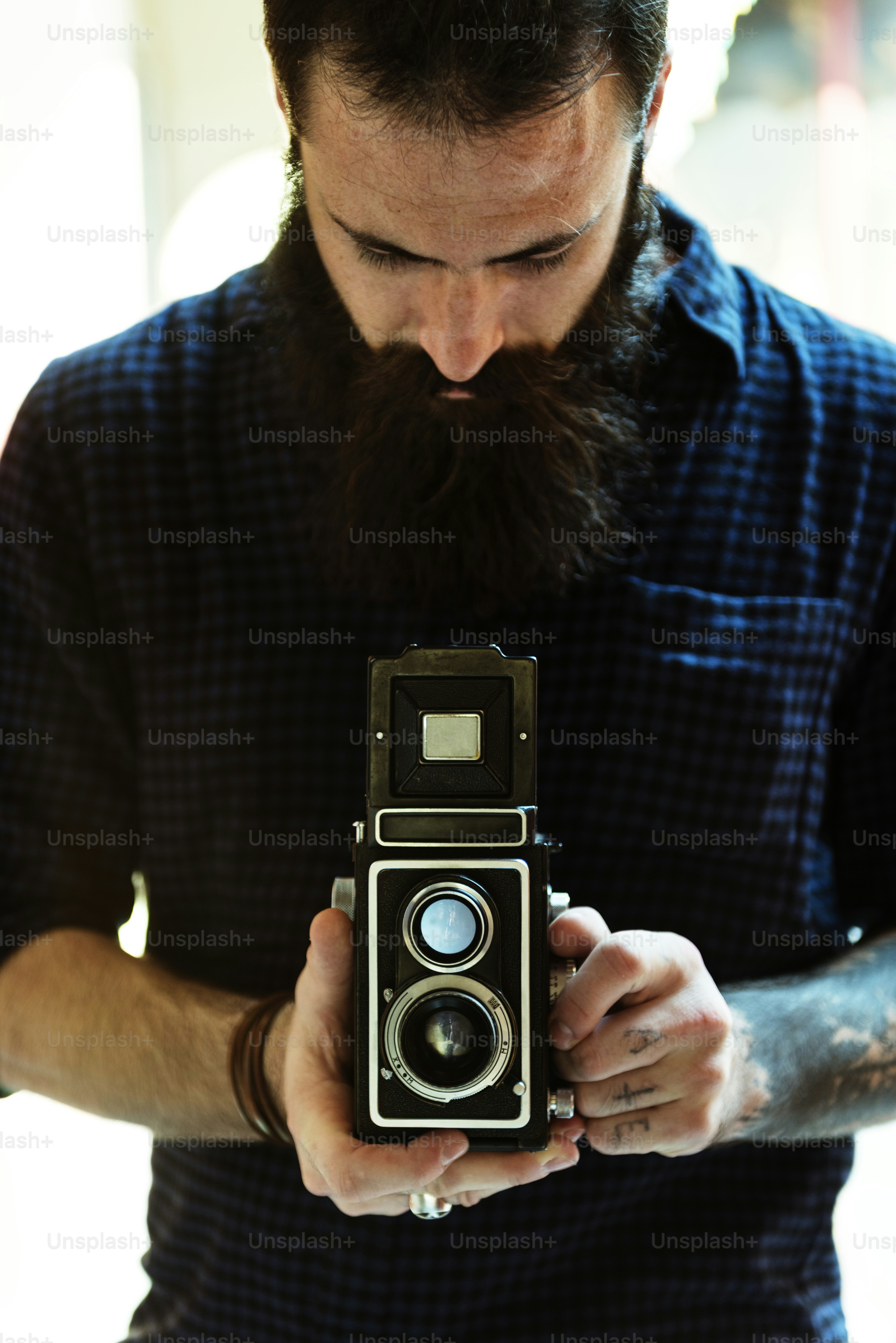 Photographer using a vintage camera