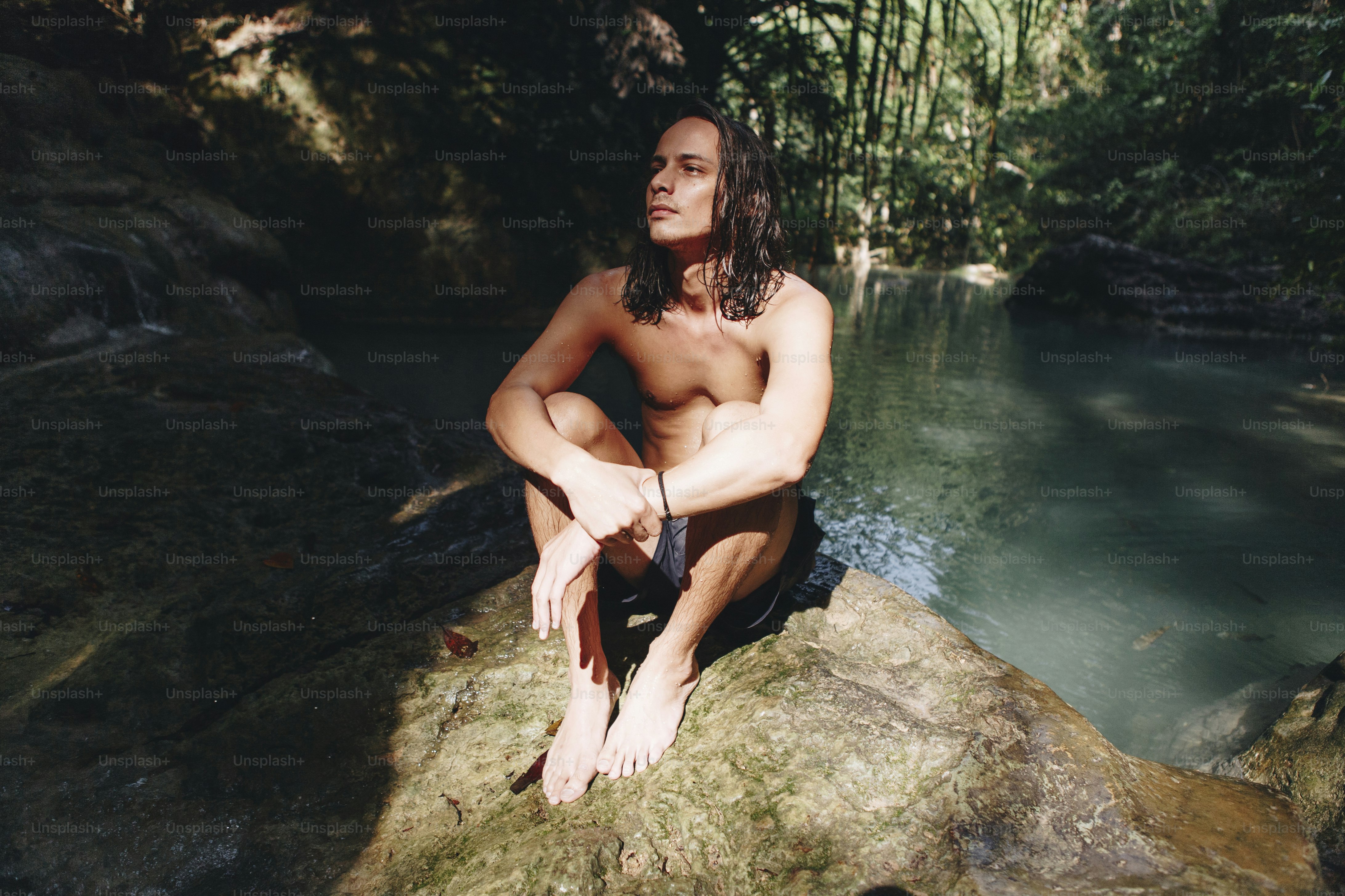 White man enjoying the waterfall
