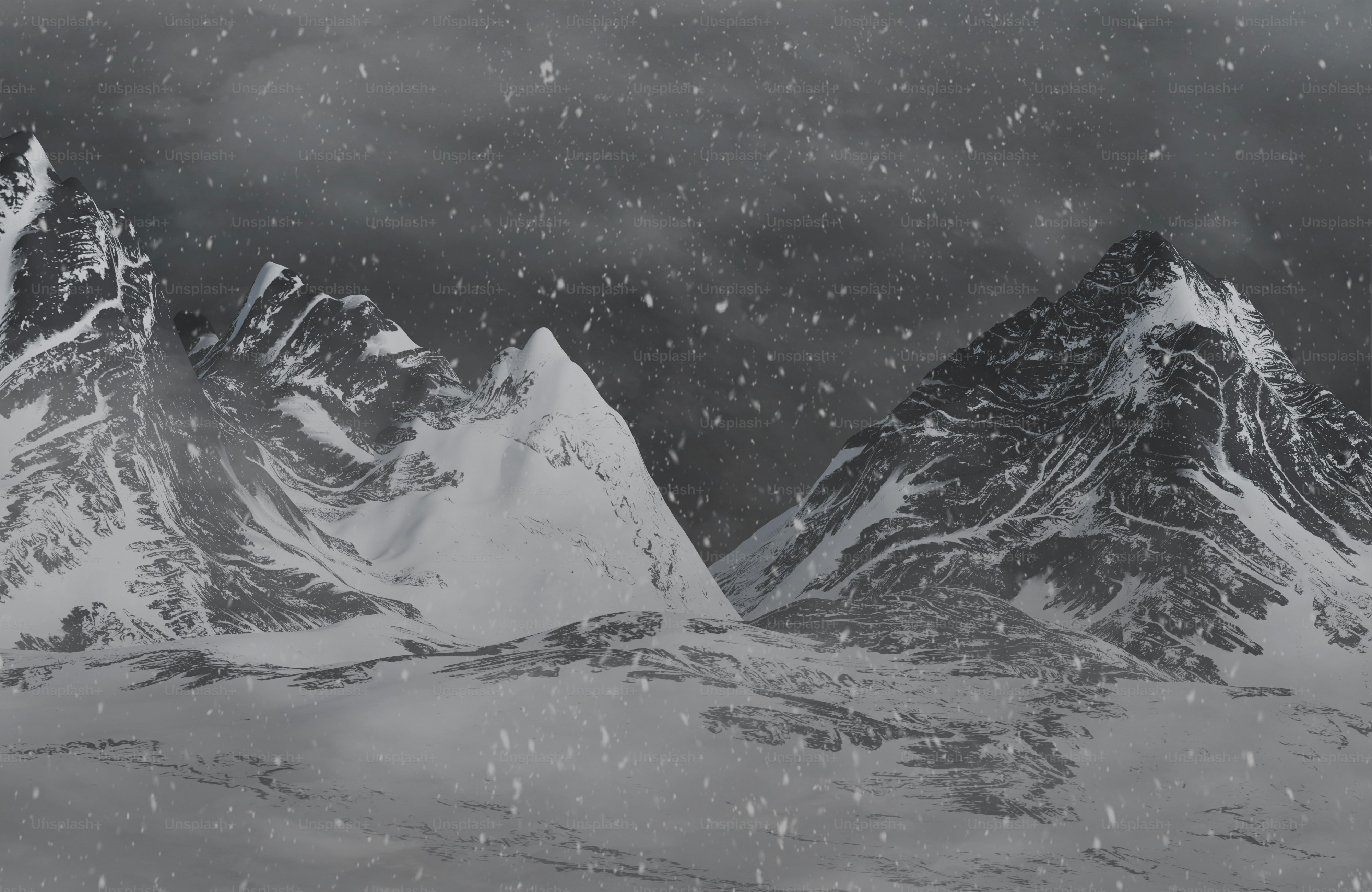 Une photo en noir et blanc de montagnes enneigées